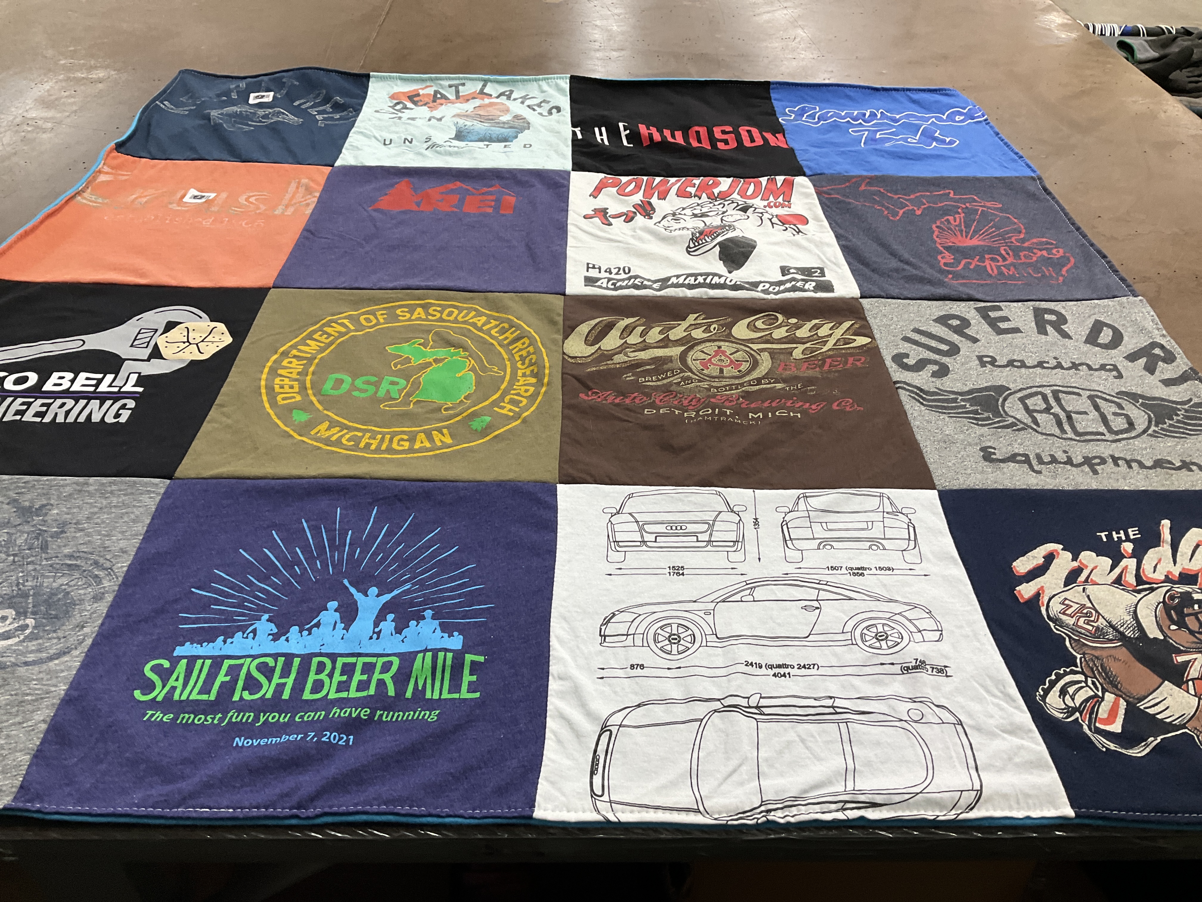 T-shirt quilt with beer, running themes by Heather from FL