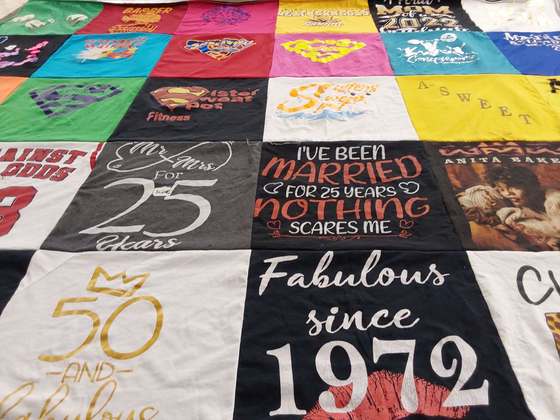 T-shirt quilt with fitness themes by DeAnn from IL