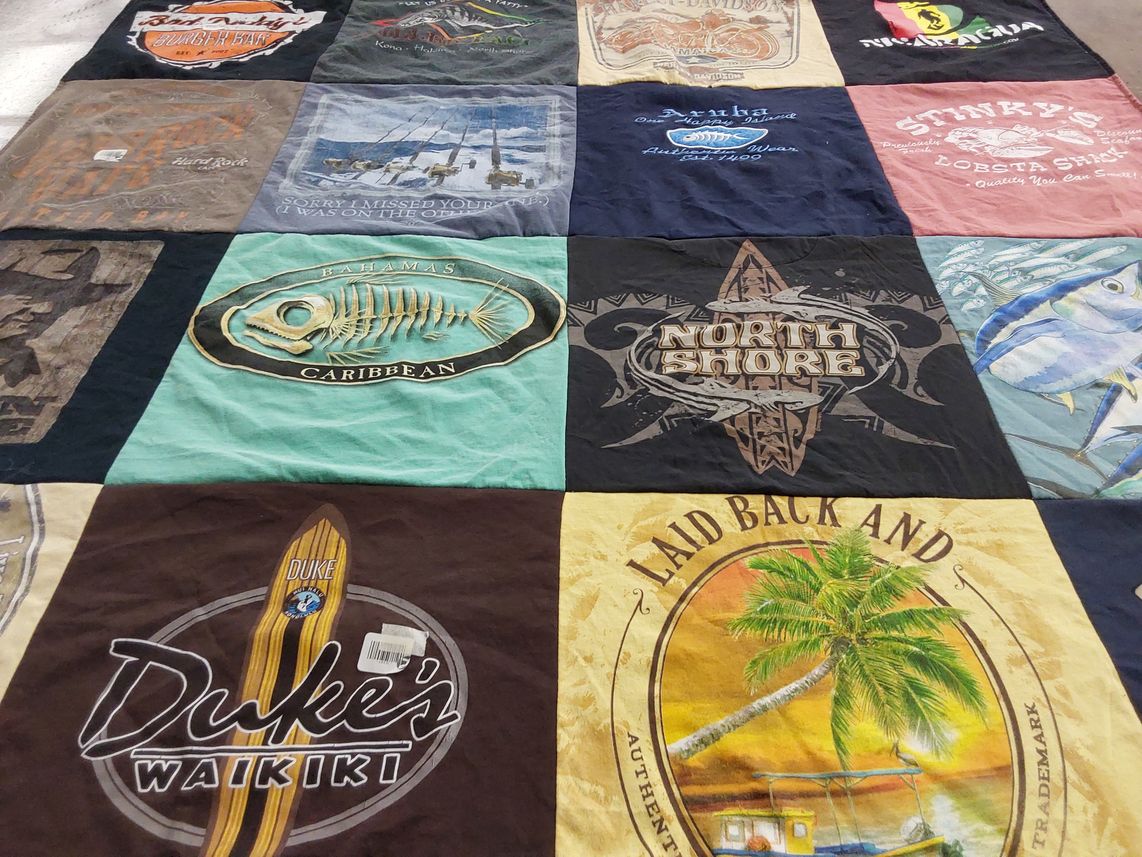 T-shirt quilt with fishing, travel themes by Barbara from NY
