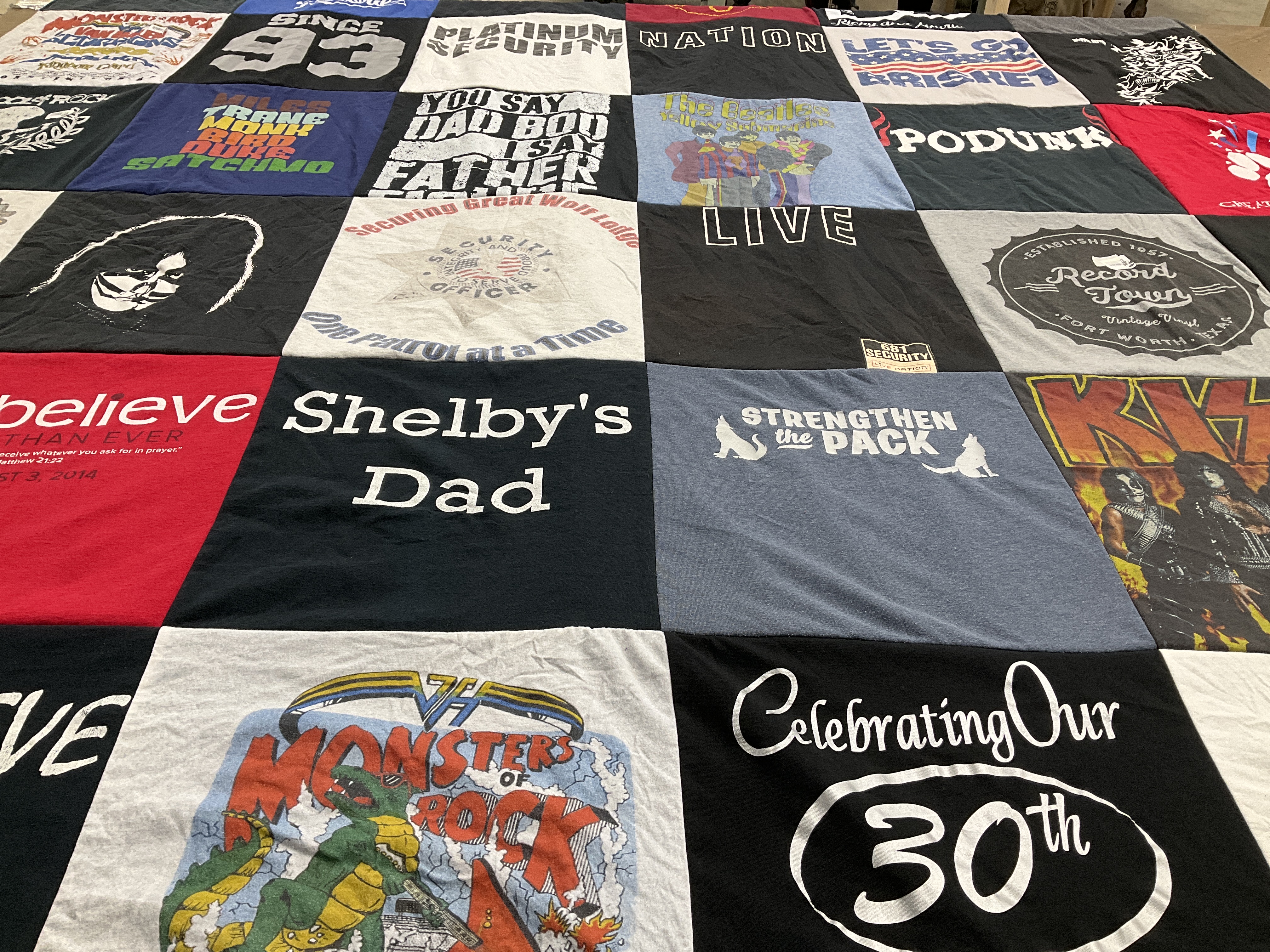 T-shirt quilt with music, security themes by Laurie from TX