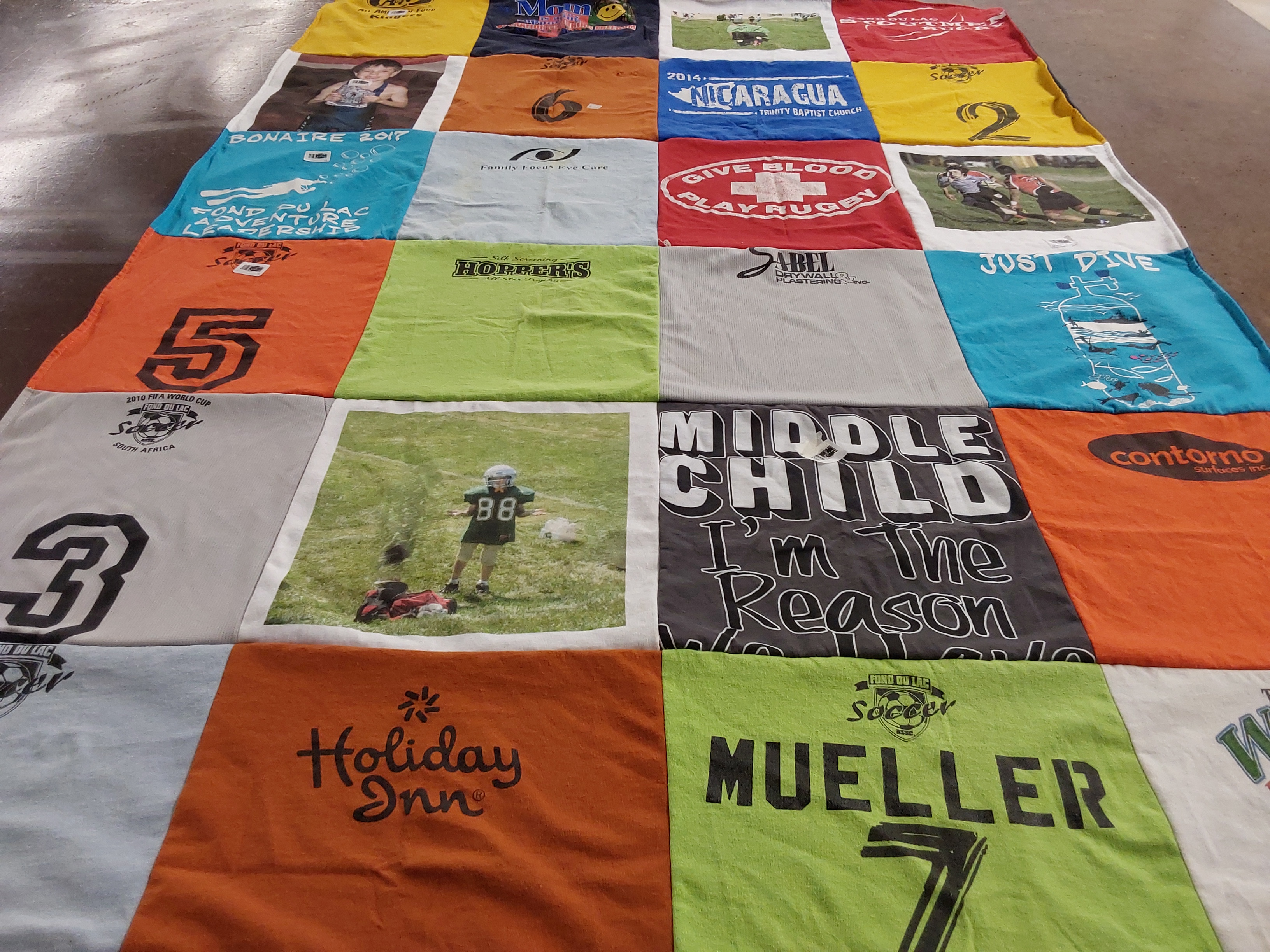 T-shirt quilt with rugby, soccer themes by Shannon from WI