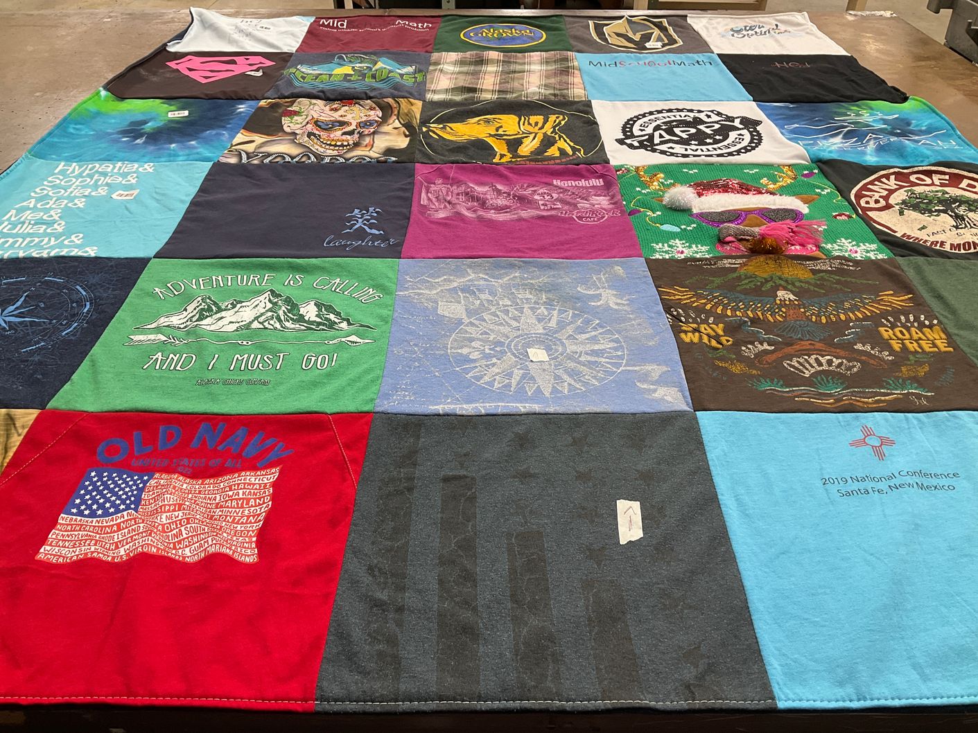 T-shirt quilt with travel, outdoors themes by Jen from AK