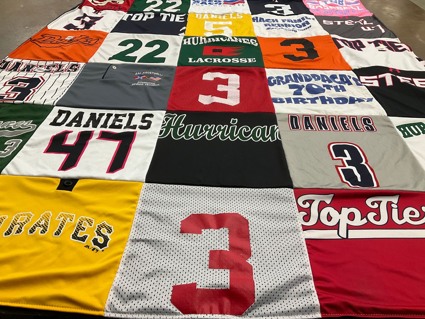 T-shirt quilt with sports, family celebrations themes by Tara from NY