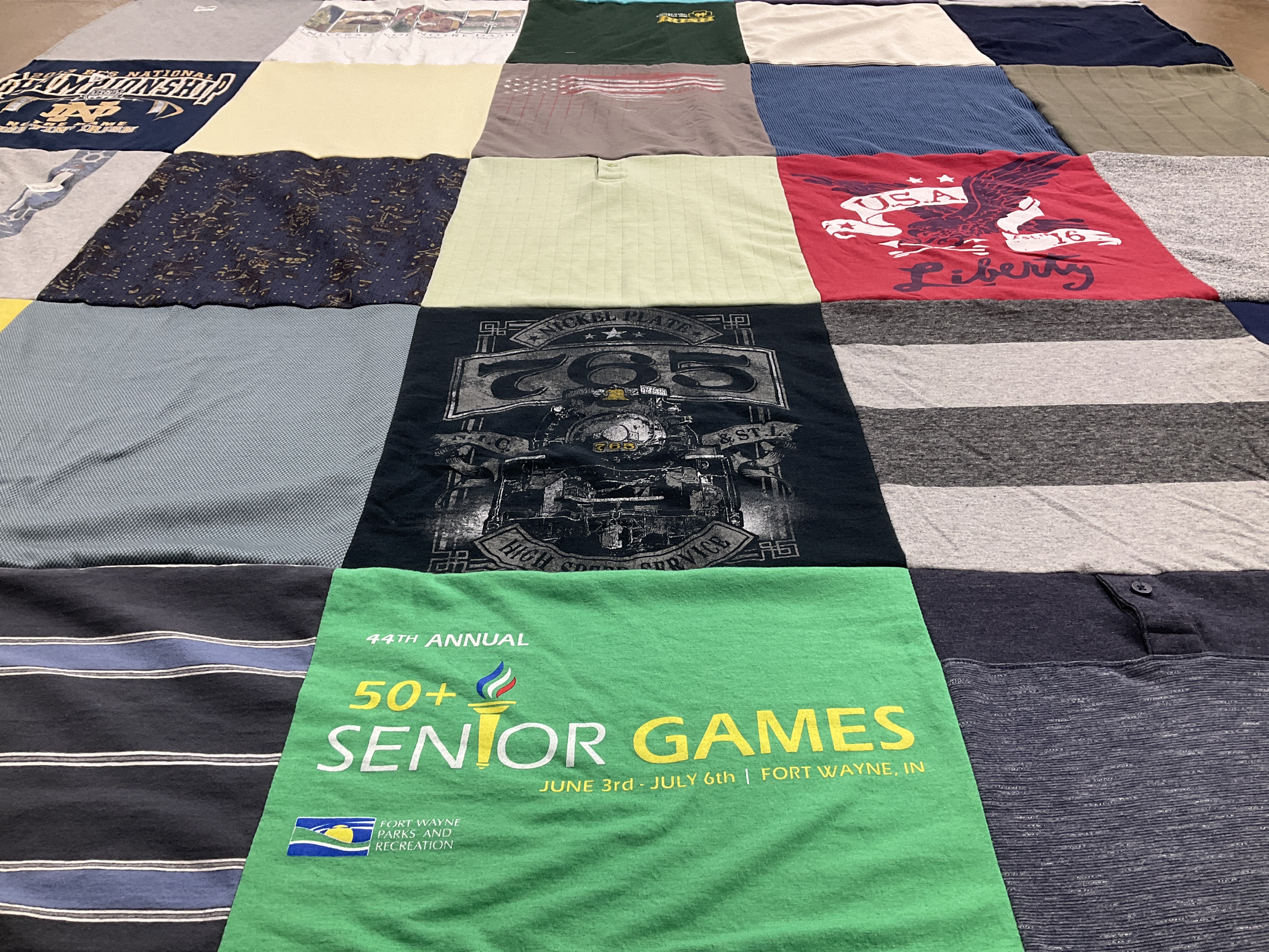 T-shirt quilt with sports, community events themes by Jenifer from IN