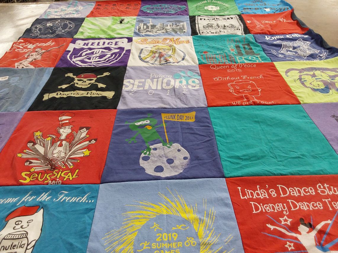 T-shirt quilt with theater, dance themes by Emily from IL