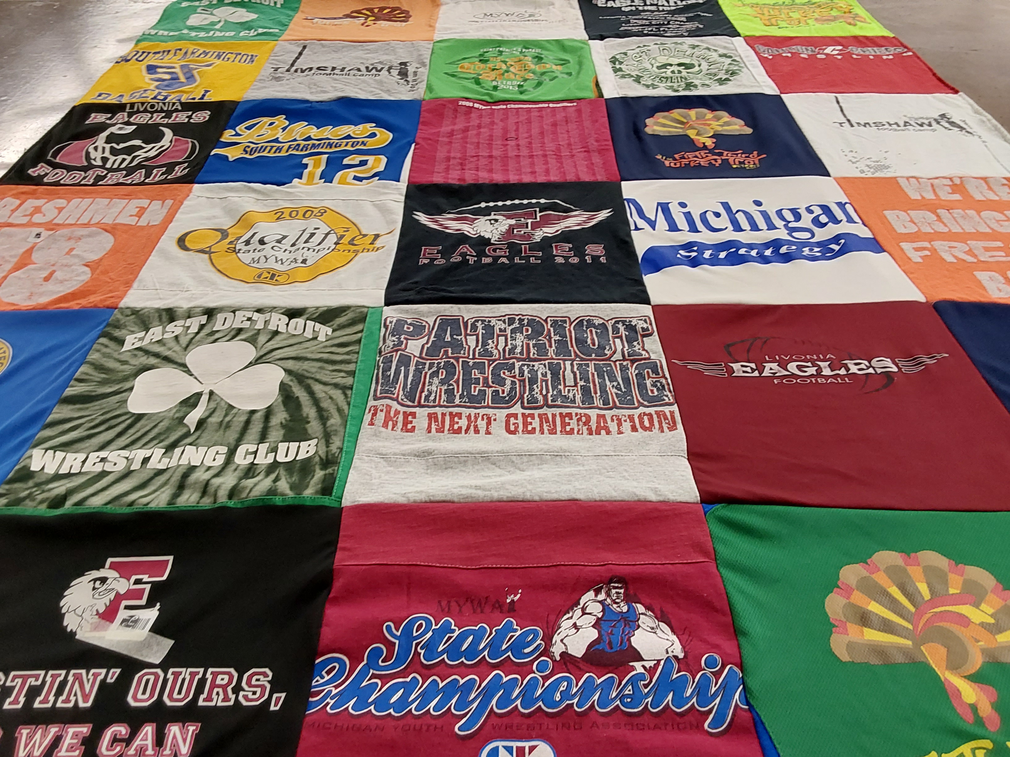 T-shirt quilt featuring eagles football, patriot wrestling by Janice from MI
