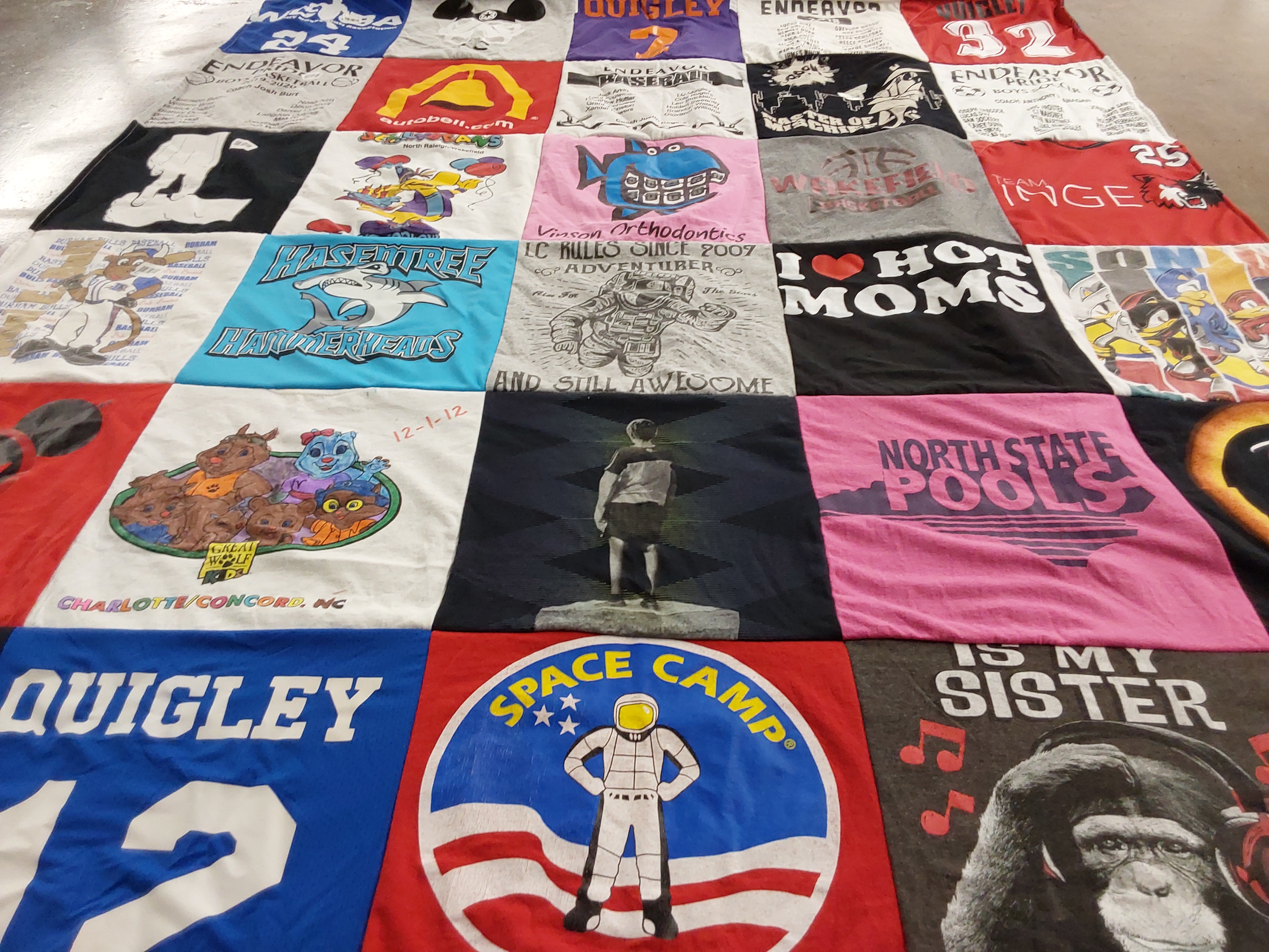 T-shirt quilt with space exploration, amusement parks themes by Amanda from NC