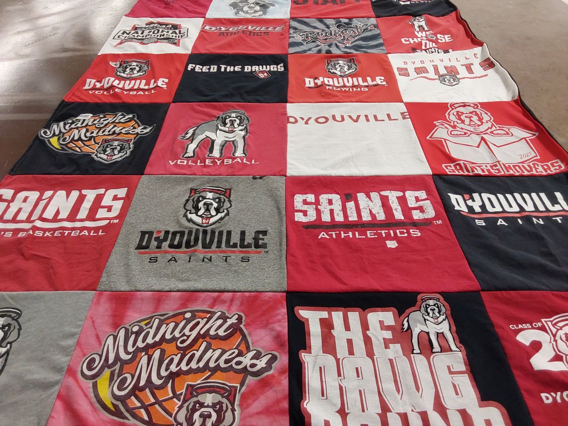 T-shirt quilt featuring d'yoville saints by Christi from NY