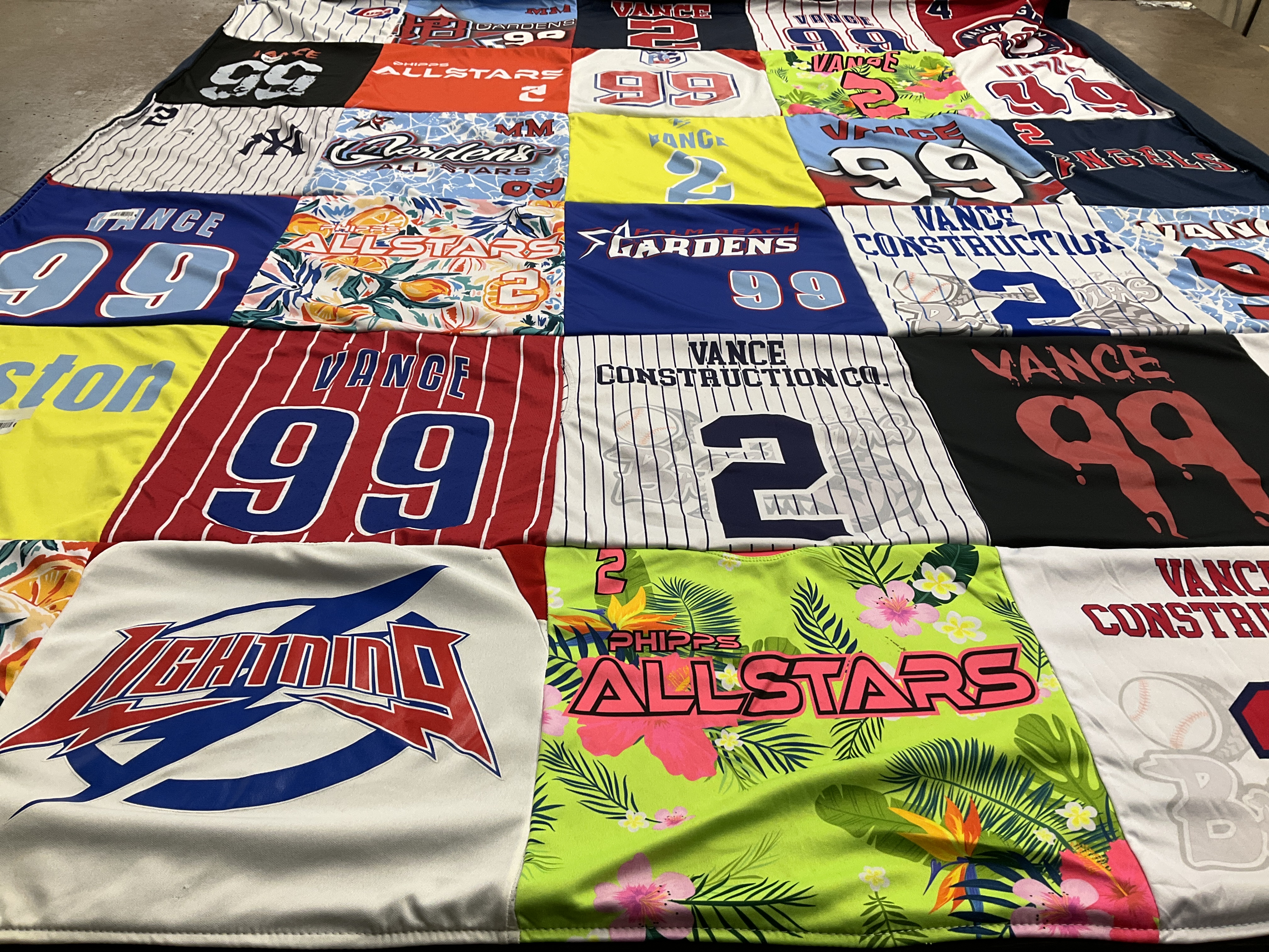 T-shirt quilt with sports, construction themes by Dolores from FL