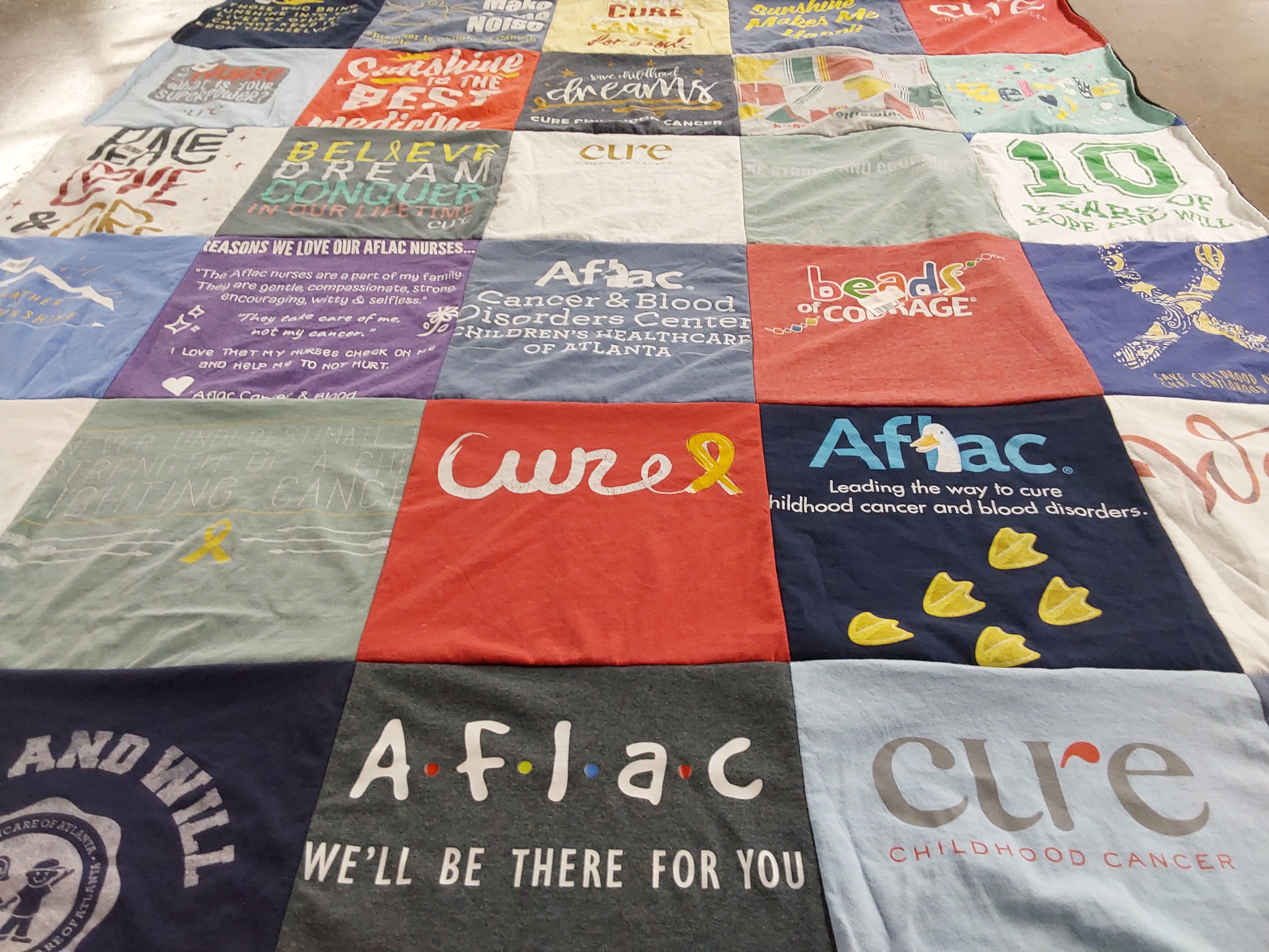 T-shirt quilt with healthcare, childhood cancer awareness themes by Leslie from GA