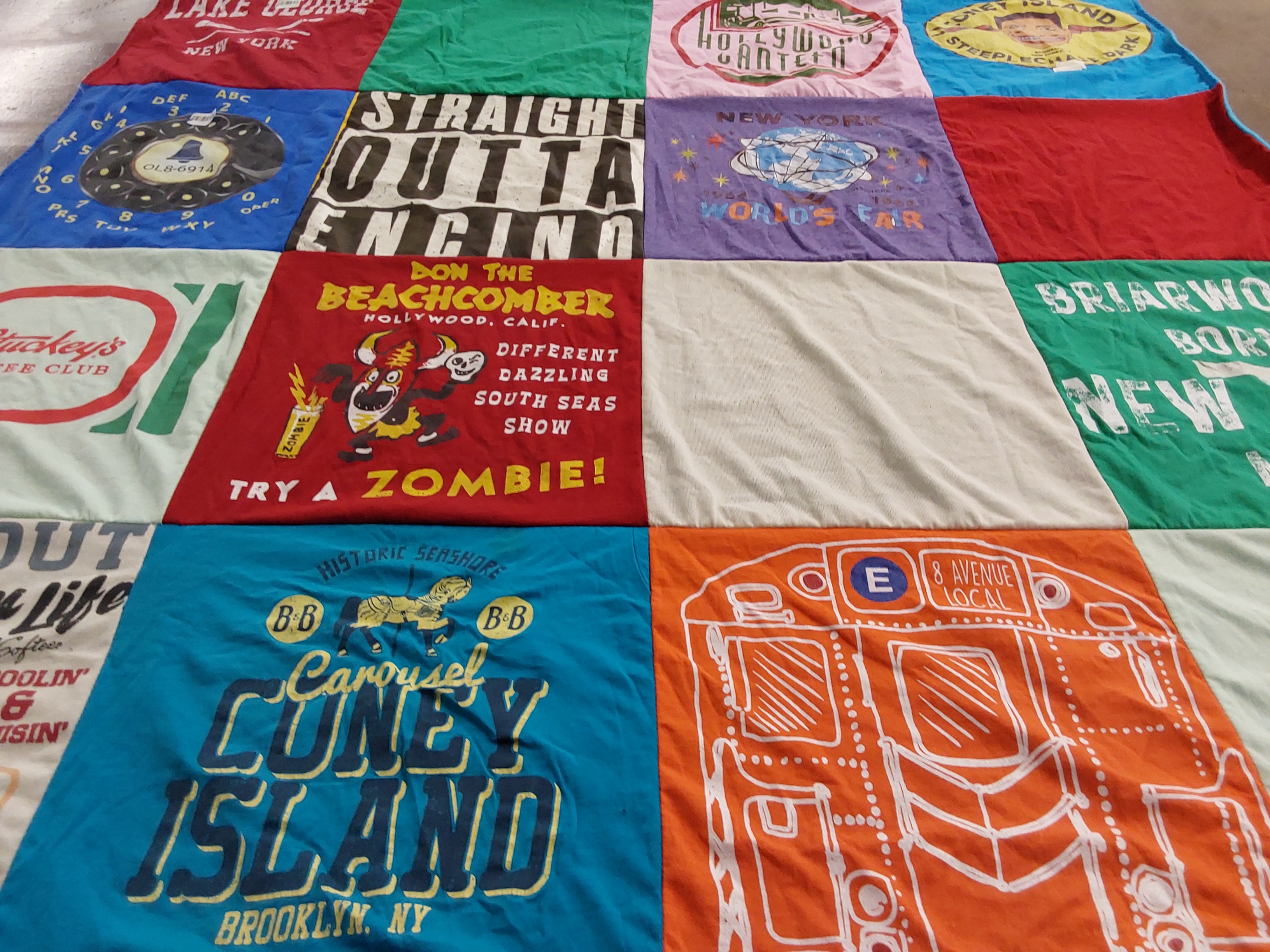 T-shirt quilt with travel, culture themes by Pam from CA