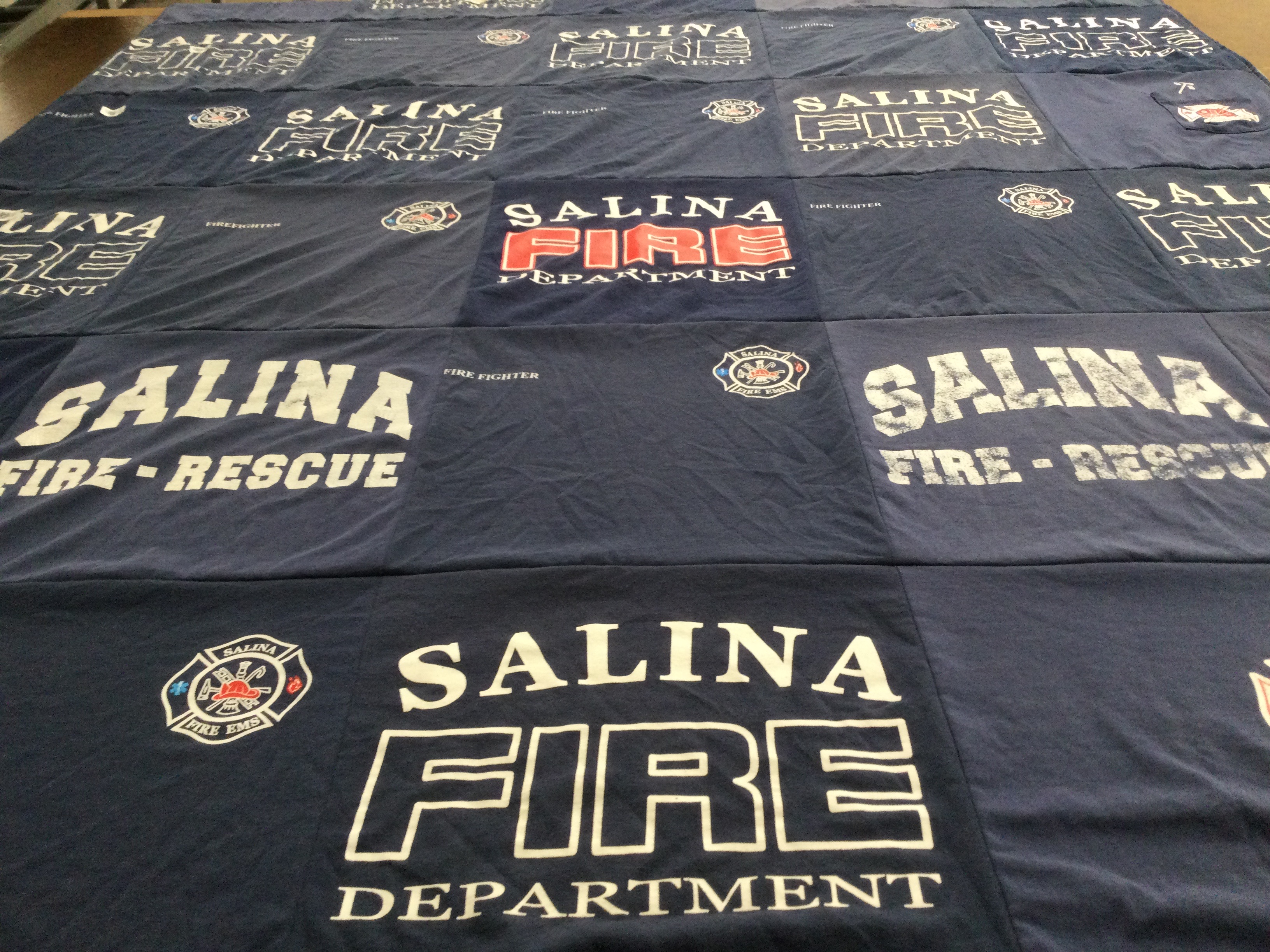 T-shirt quilt with firefighting, emergency services themes by Breanna from KS