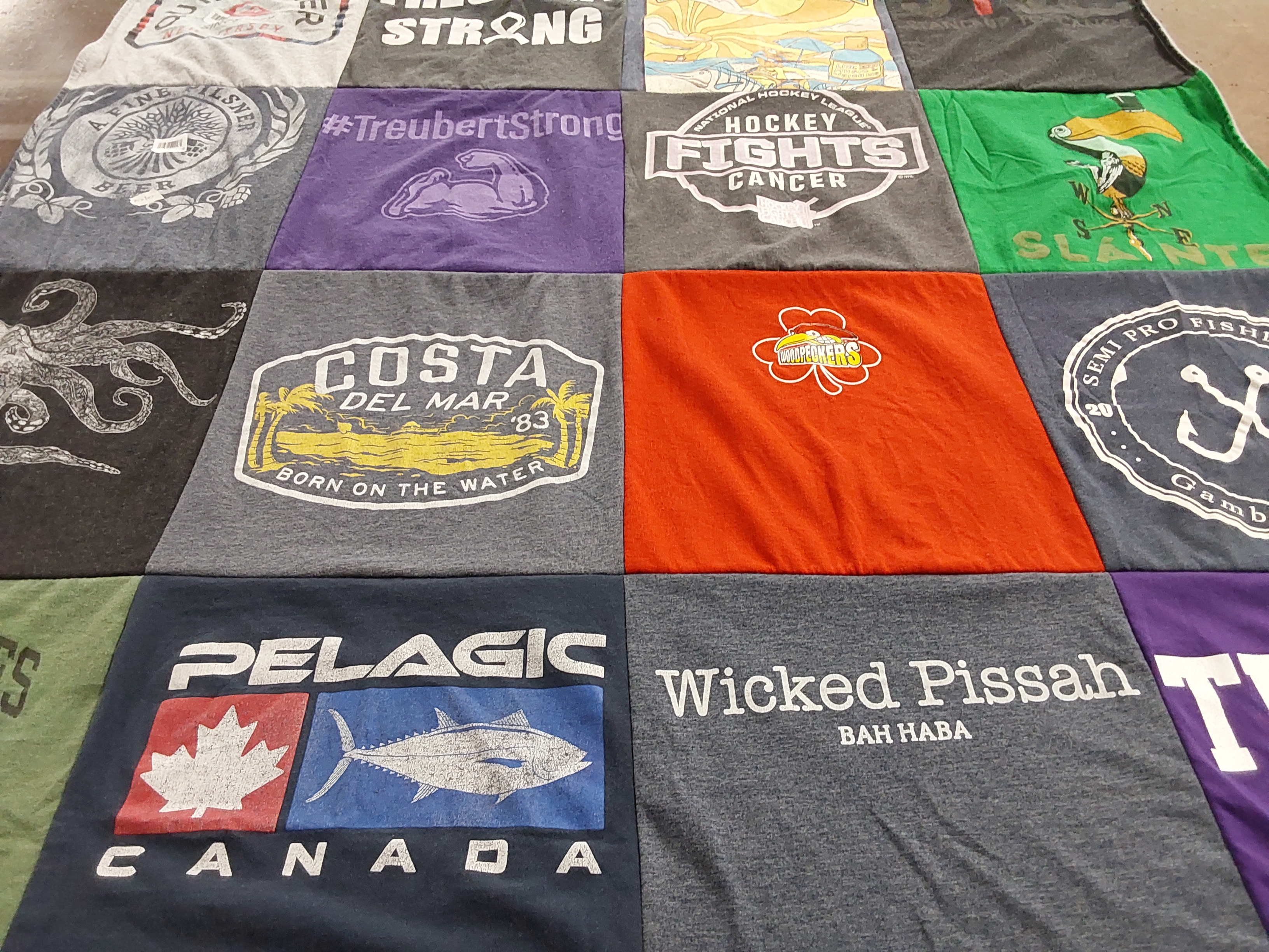T-shirt quilt with fishing, hockey themes by Stephanie from NJ