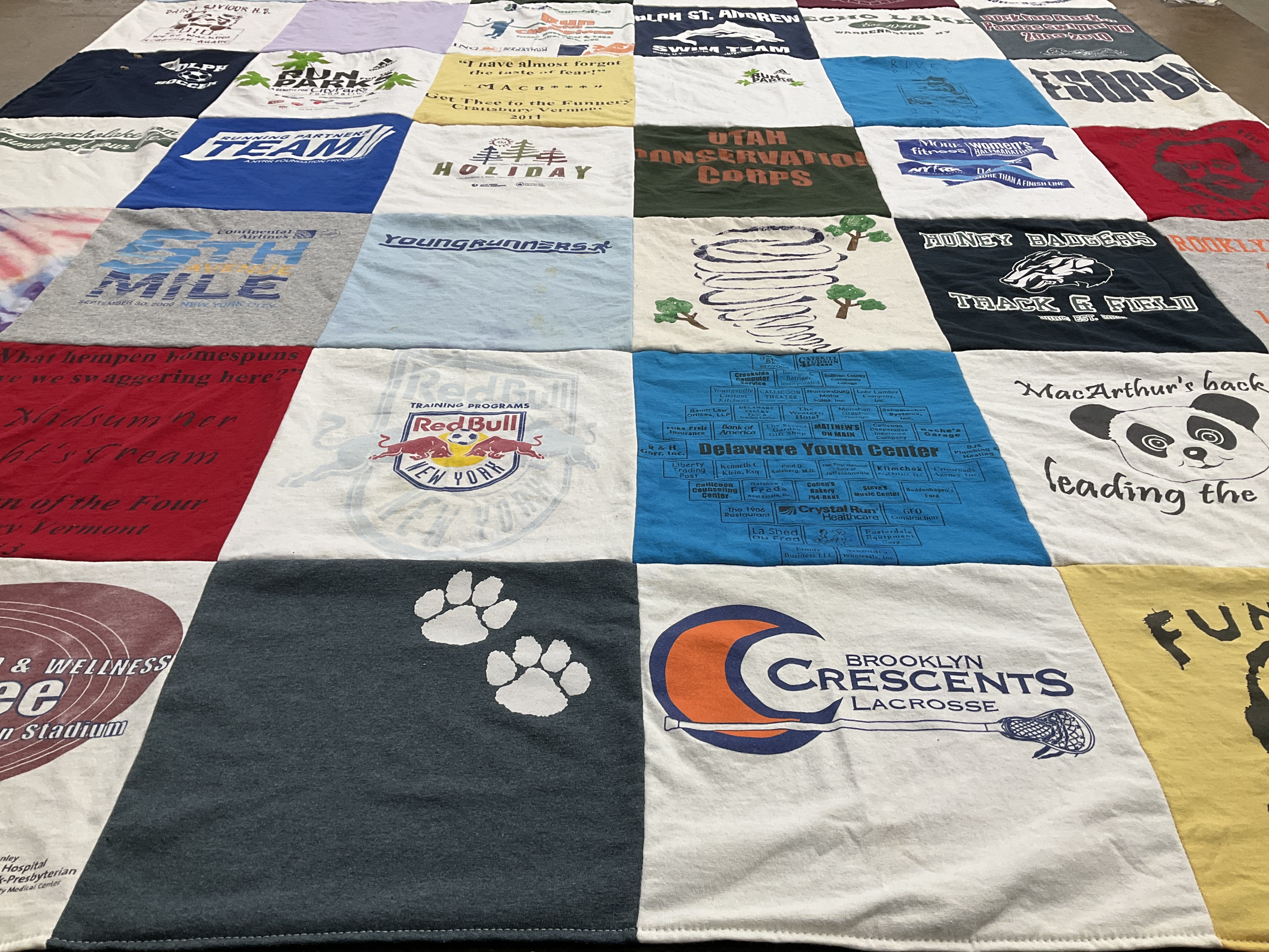 T-shirt quilt featuring money bangers track and field by Honora from NY