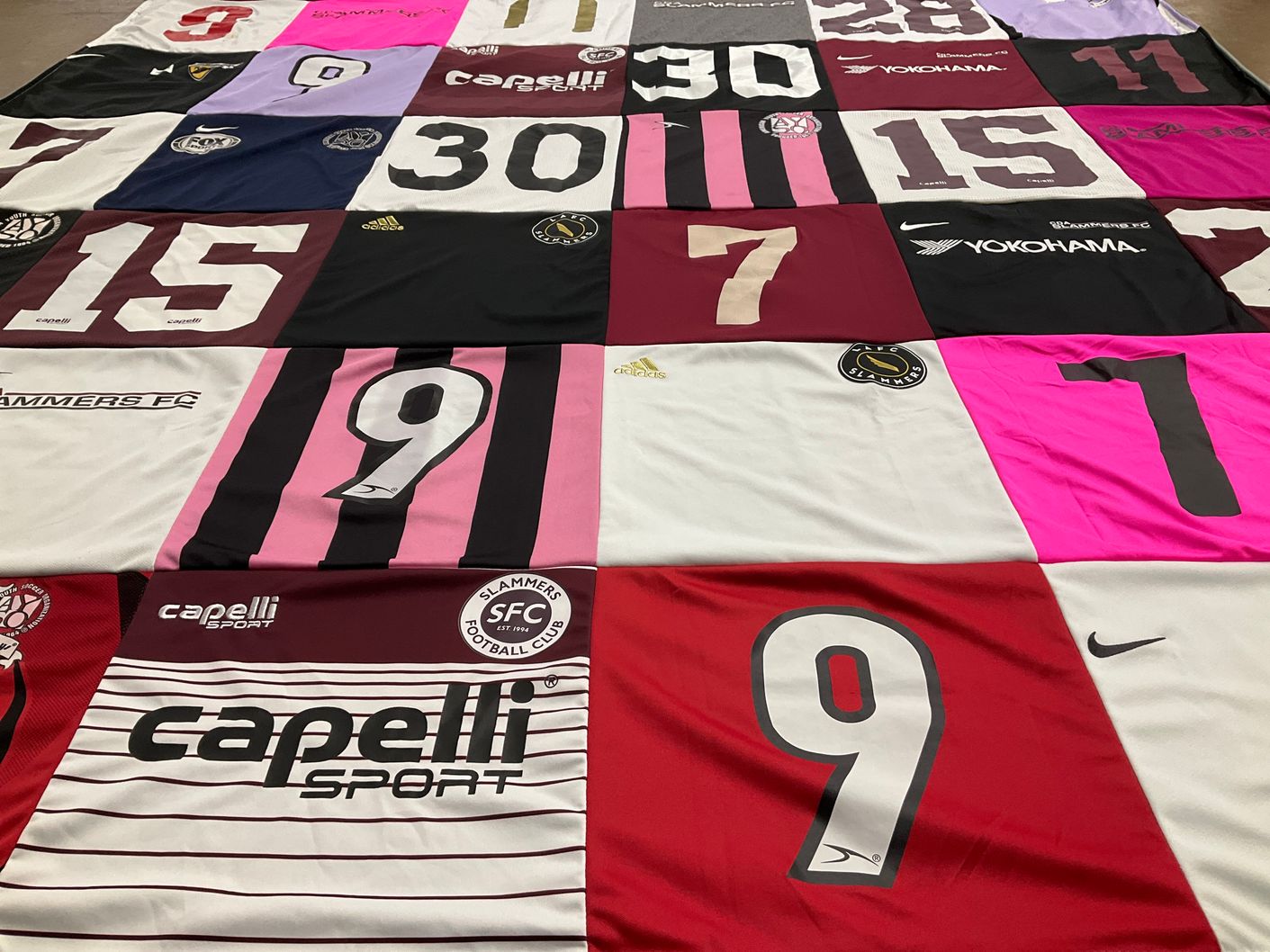 T-shirt quilt with soccer, football themes by Jeniece from CA