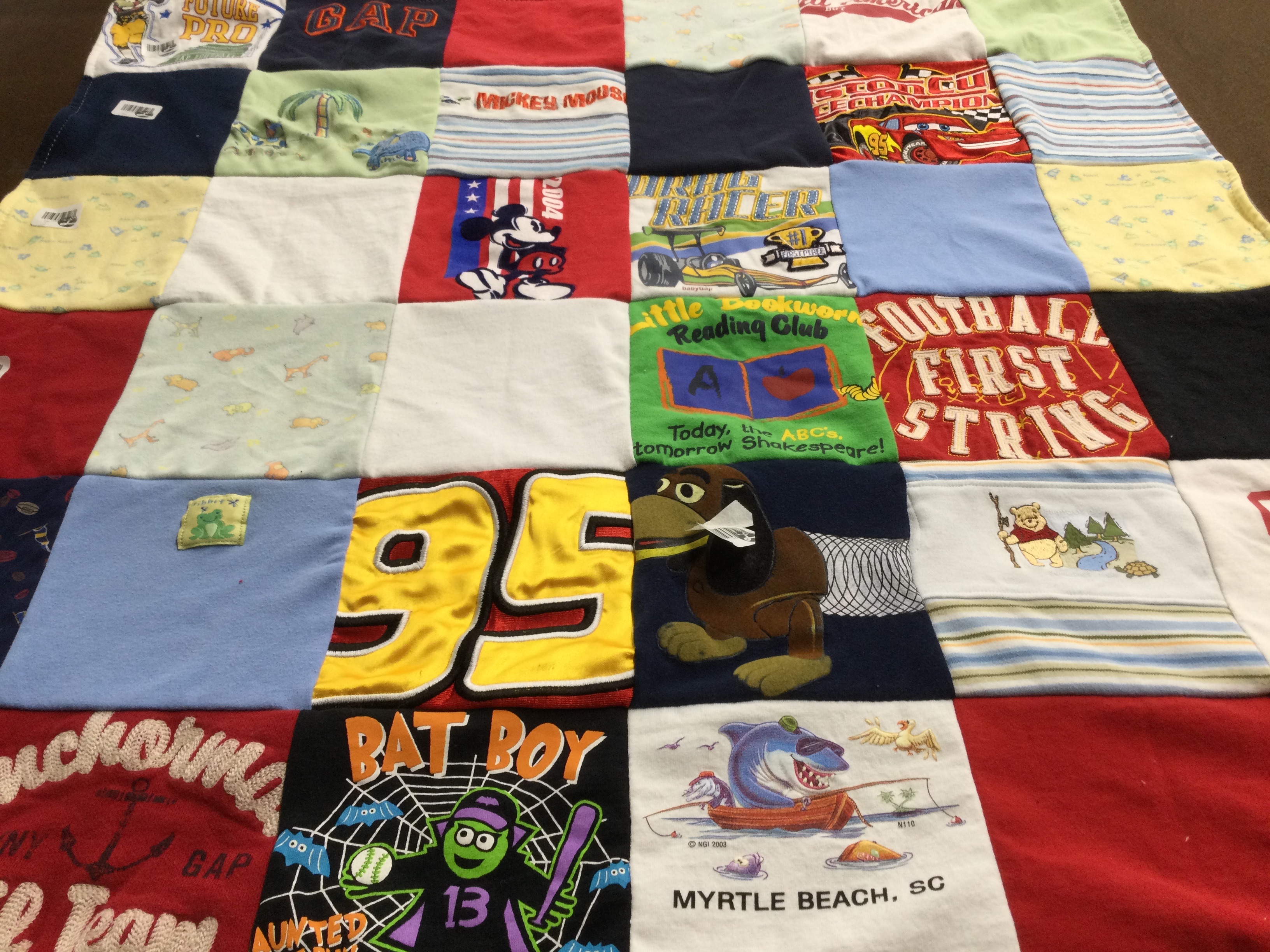 T-shirt quilt with reading, sports themes by Cassandra from VA