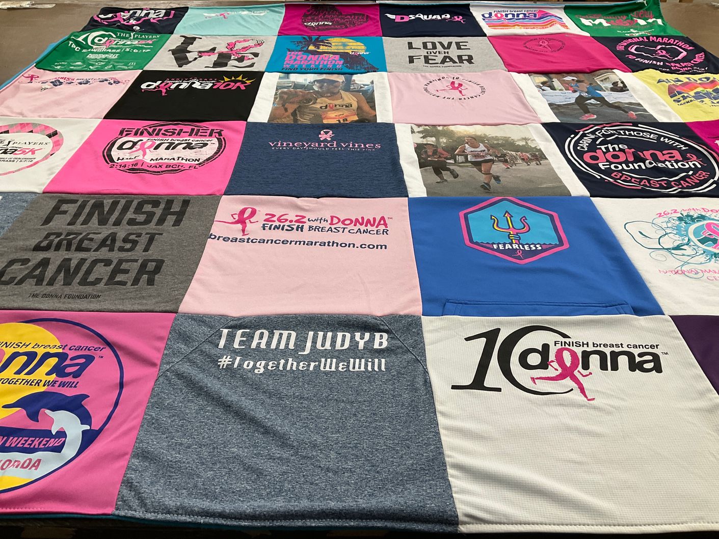 T-shirt quilt with breast cancer awareness, running themes by Donna from FL
