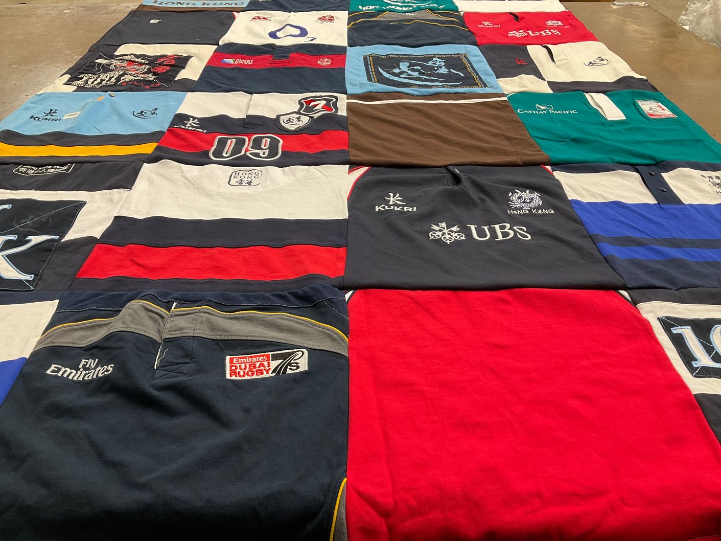 T-shirt quilt with rugby, travel themes by Dana from NJ