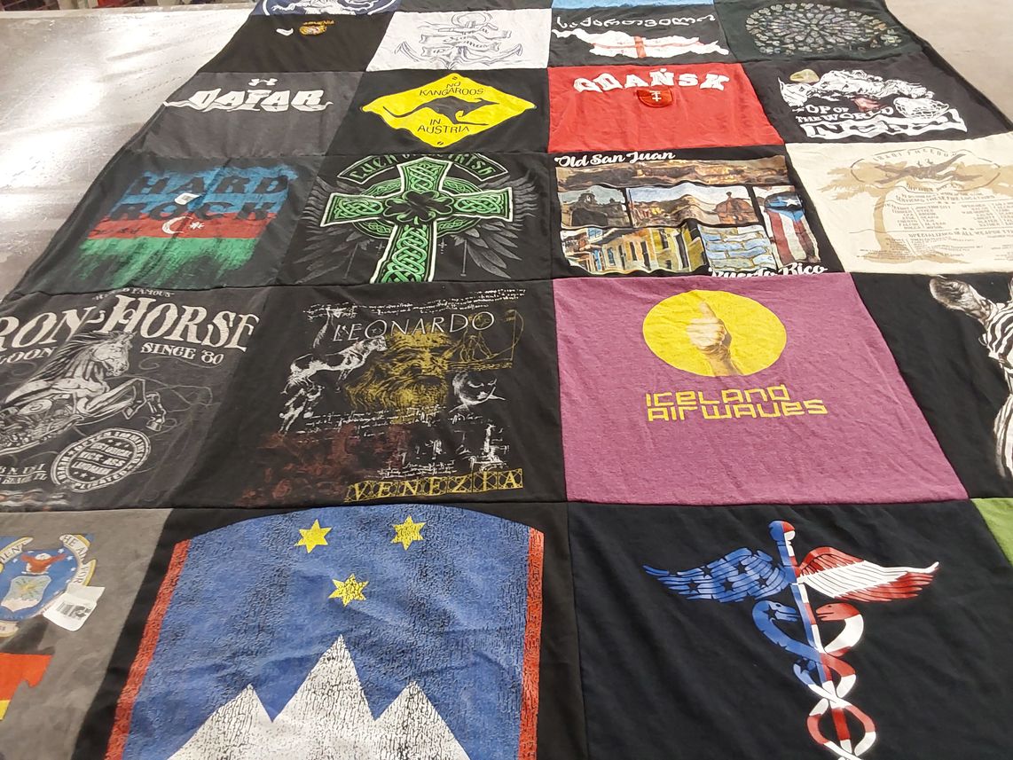 T-shirt quilt with travel, music themes by Jessie from CO