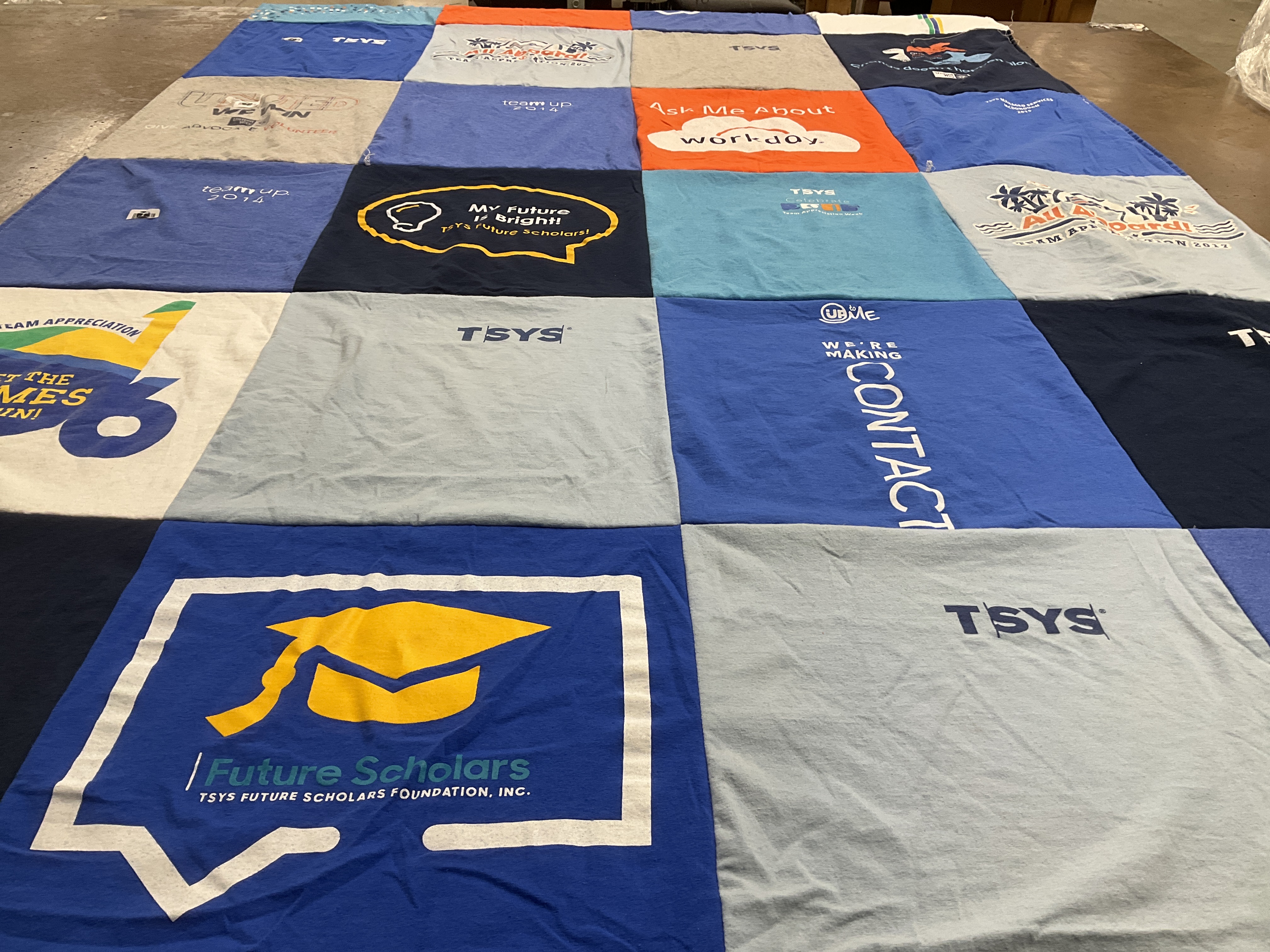 T-shirt quilt with education, team building themes by Susanne from AL