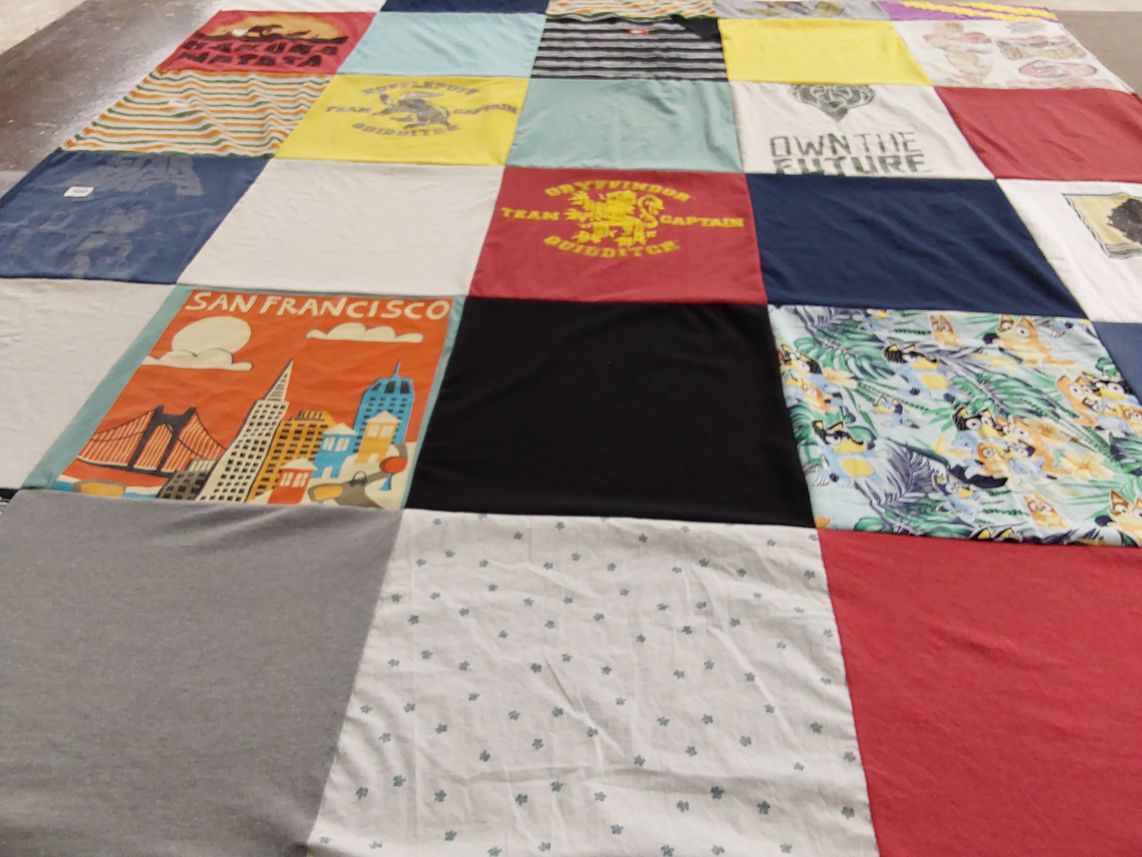 T-shirt quilt with travel, art themes by Teryn from UT