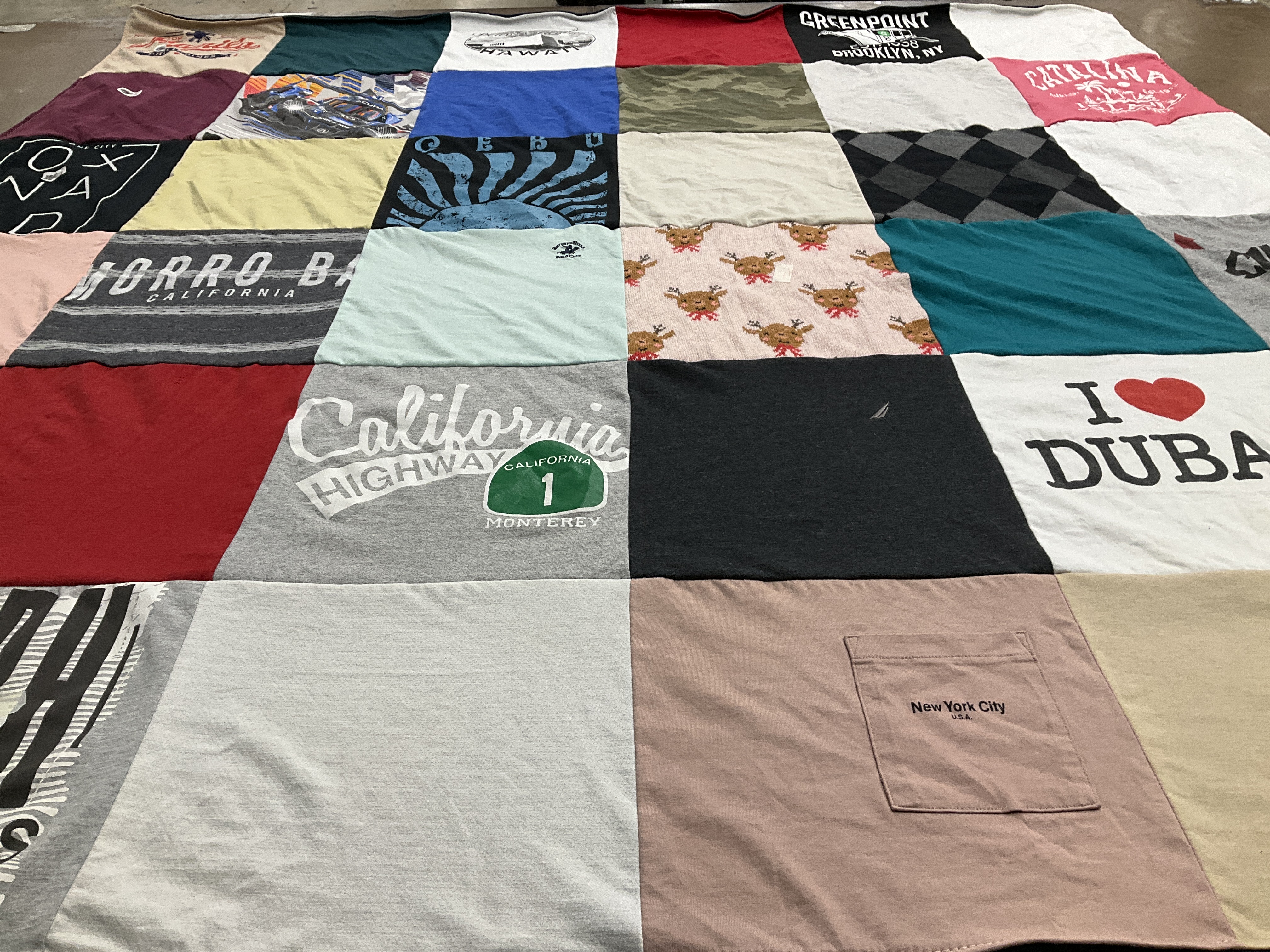 T-shirt quilt with travel, cities themes by Maria from CA