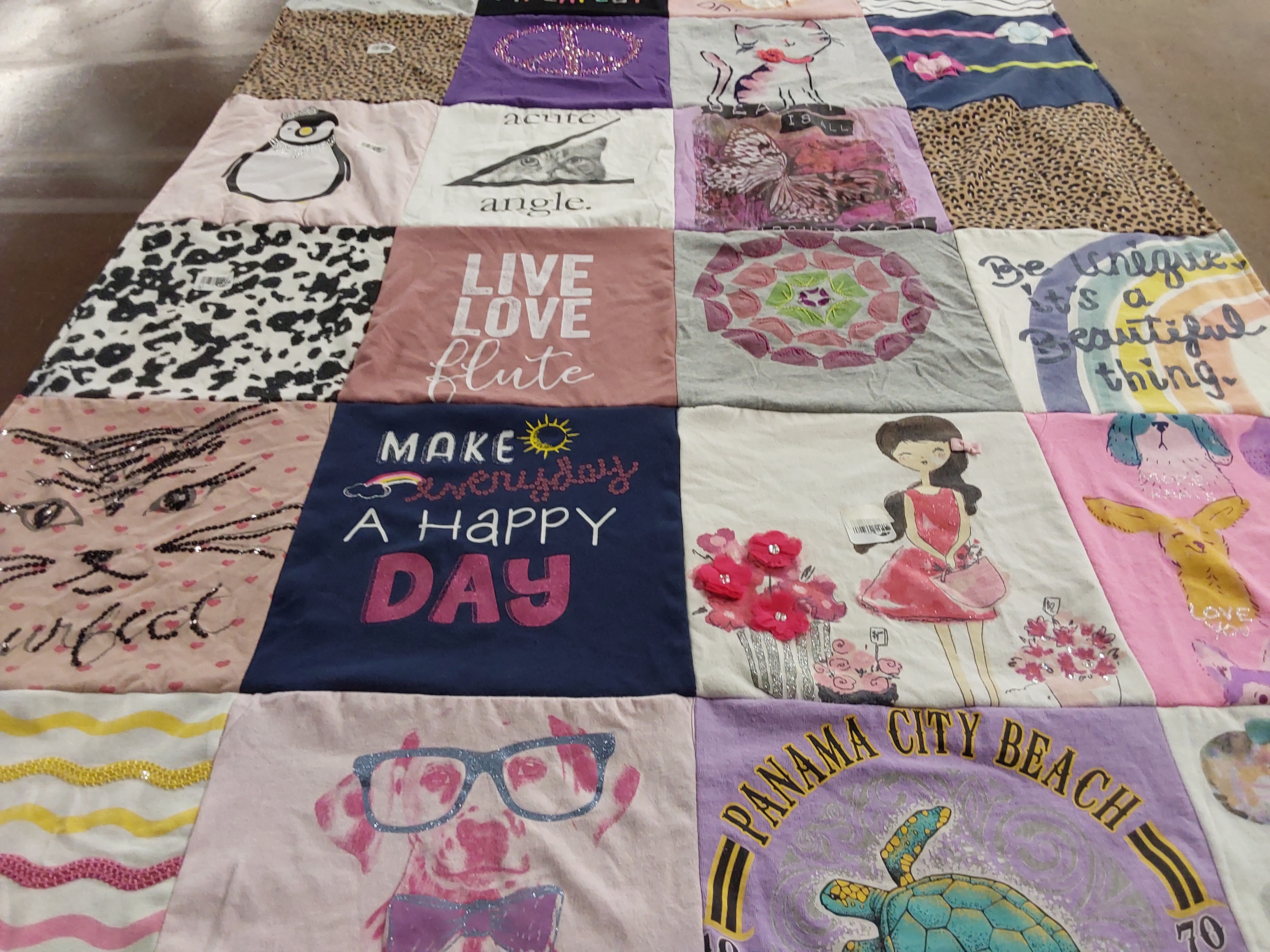 T-shirt quilt with music, art themes by Amy from TX
