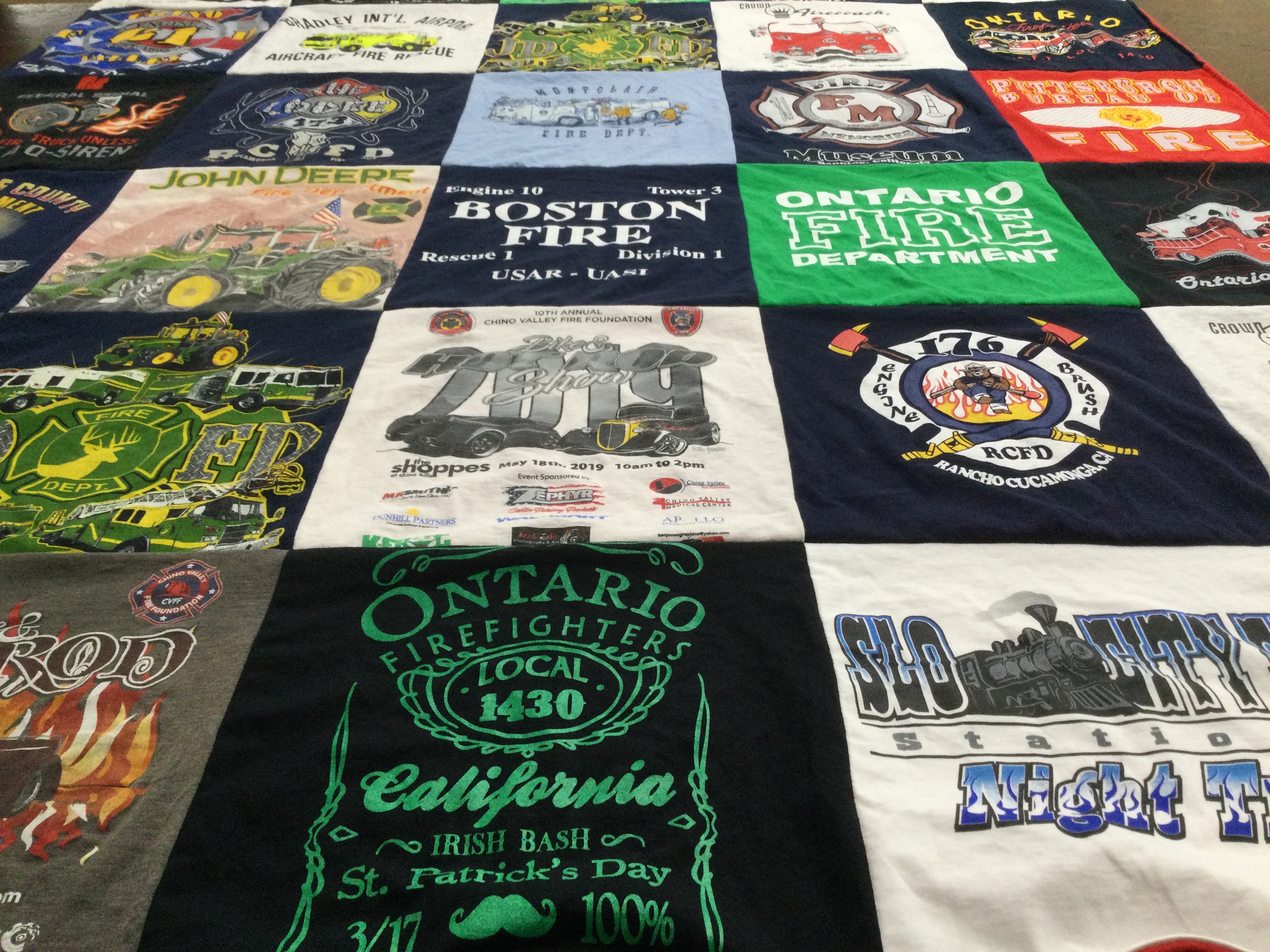 T-shirt quilt with firefighting, firesafety themes by John from CA