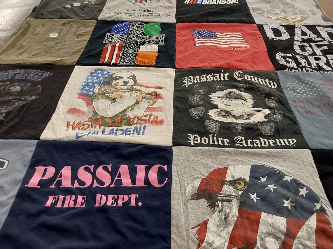 T-shirt quilt with law enforcement, firefighting themes by Shirley from NJ