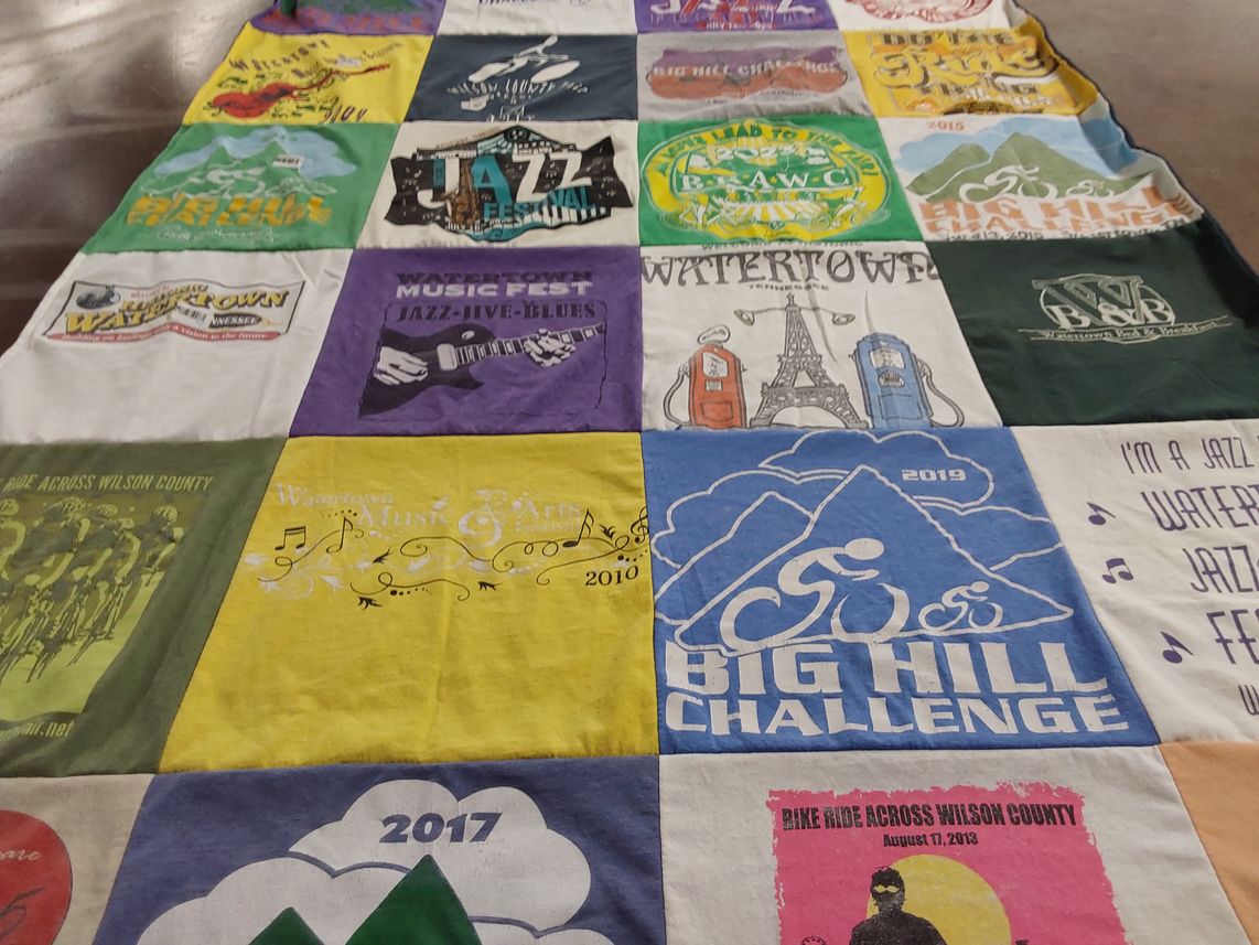 T-shirt quilt with music, cycling themes by Alana from TN