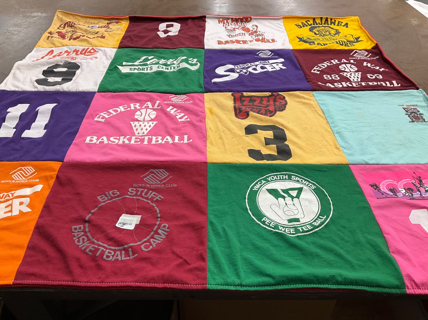 T-shirt quilt with basketball, soccer themes by Deborah from WA
