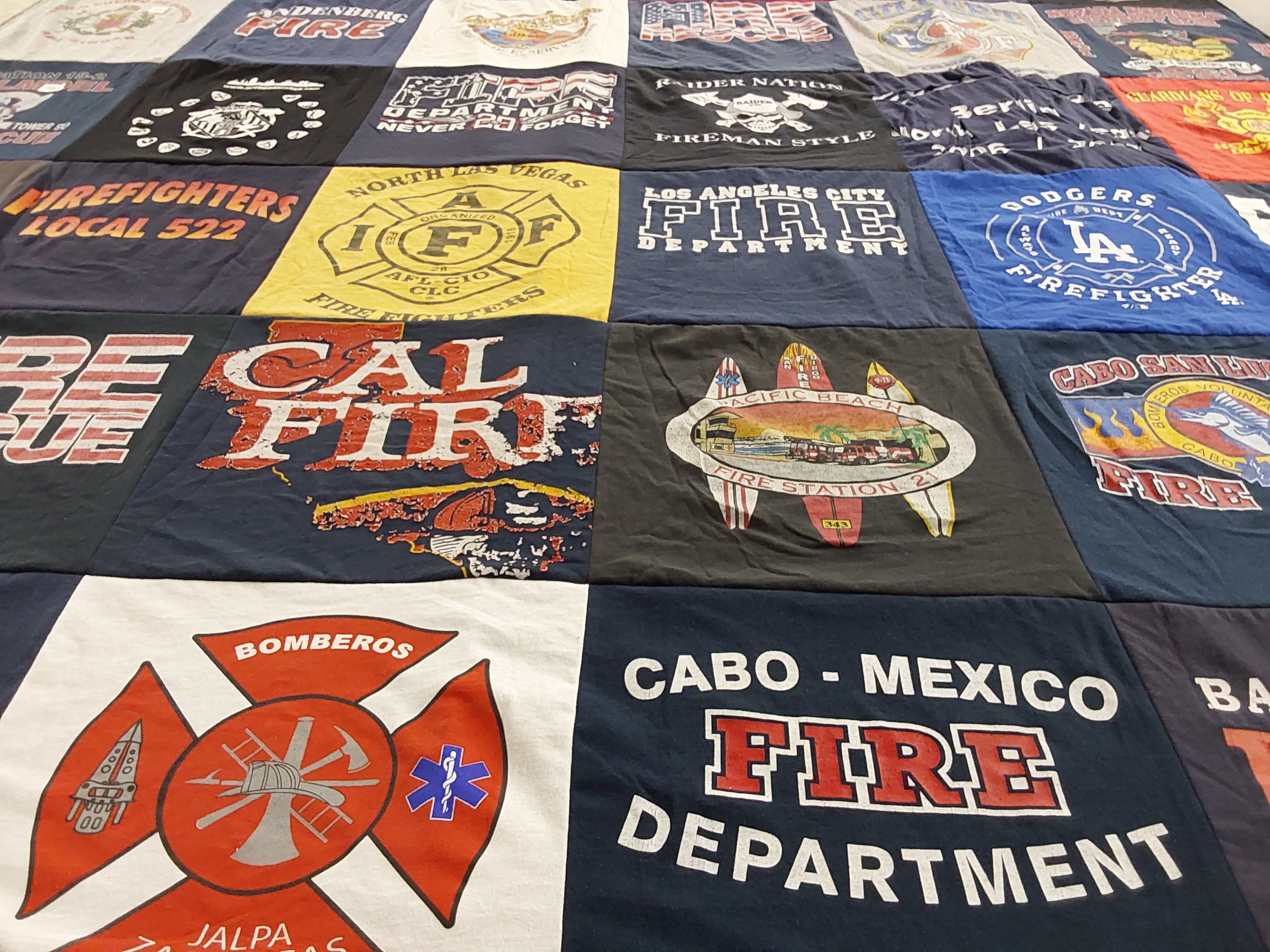 T-shirt quilt with firefighting themes by Maria from CA
