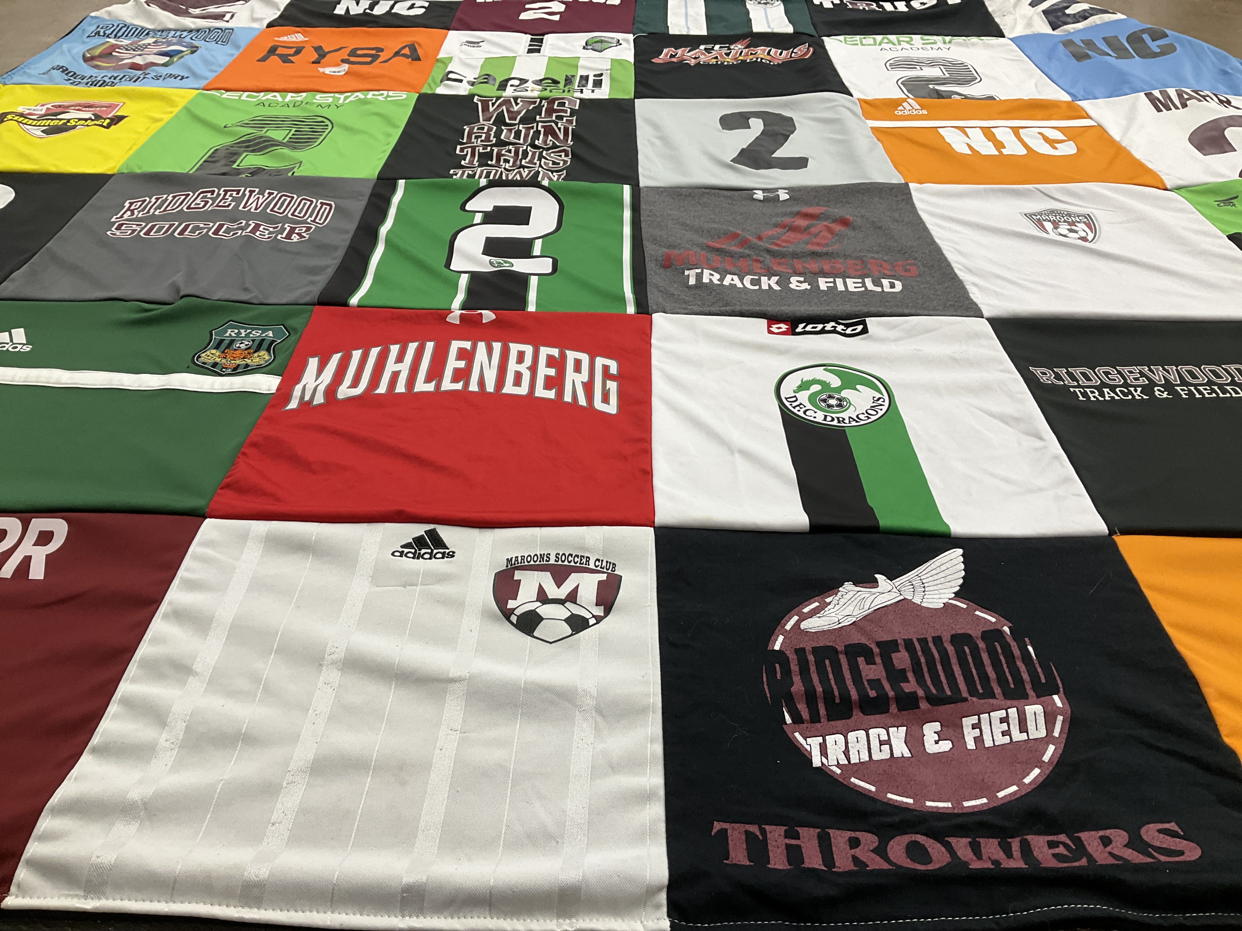 T-shirt quilt featuring ridgewood track and field, ridgewood soccer club by Emily from NJ