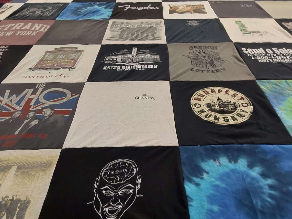 T-shirt quilt with music, travel themes by Loretta from WA
