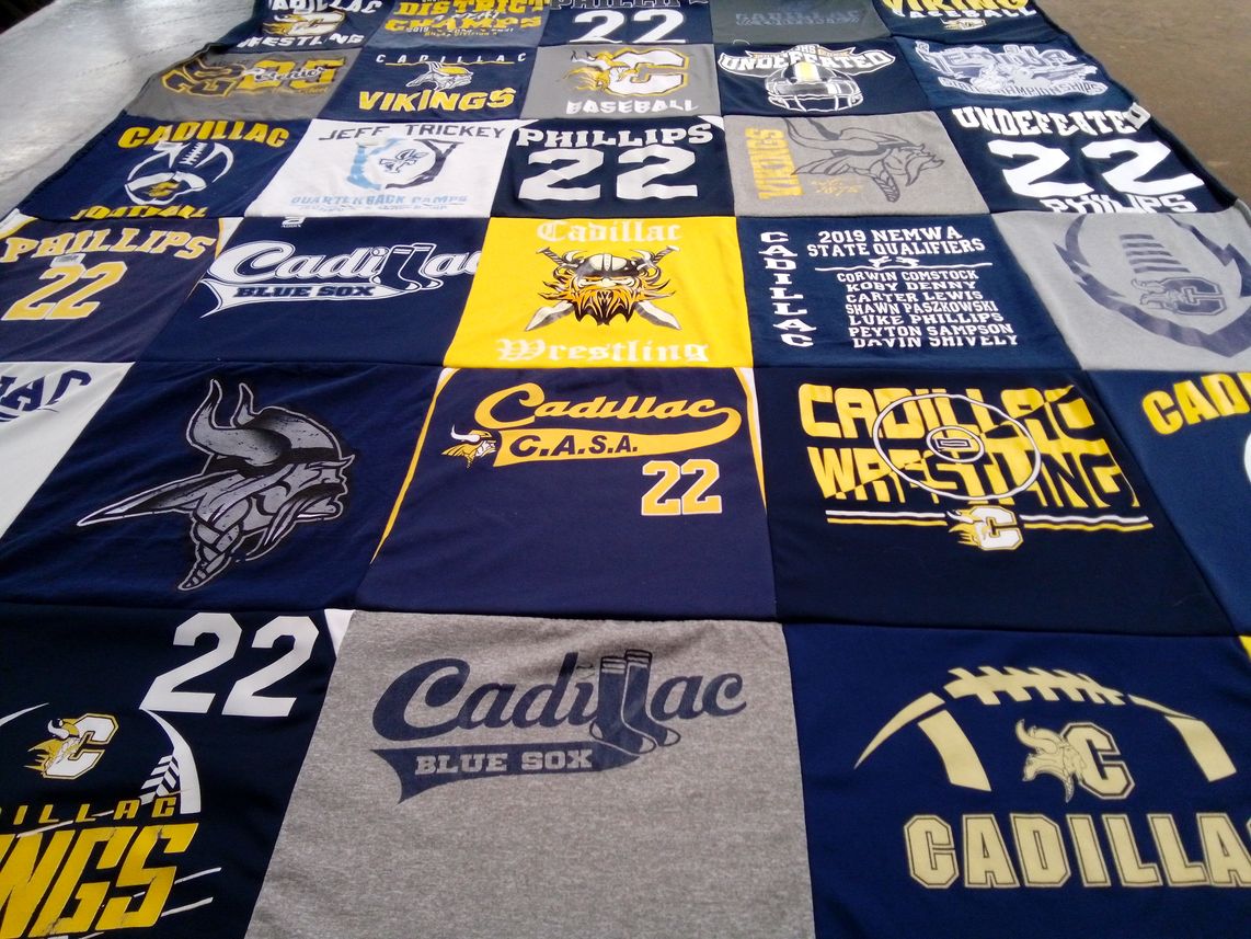 T-shirt quilt featuring cadillac vikings, cadillac blue sox by Amy from MI