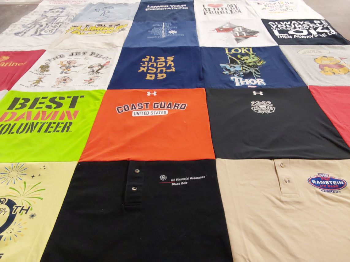T-shirt quilt with volunteer work, marvel themes by leslie from FL