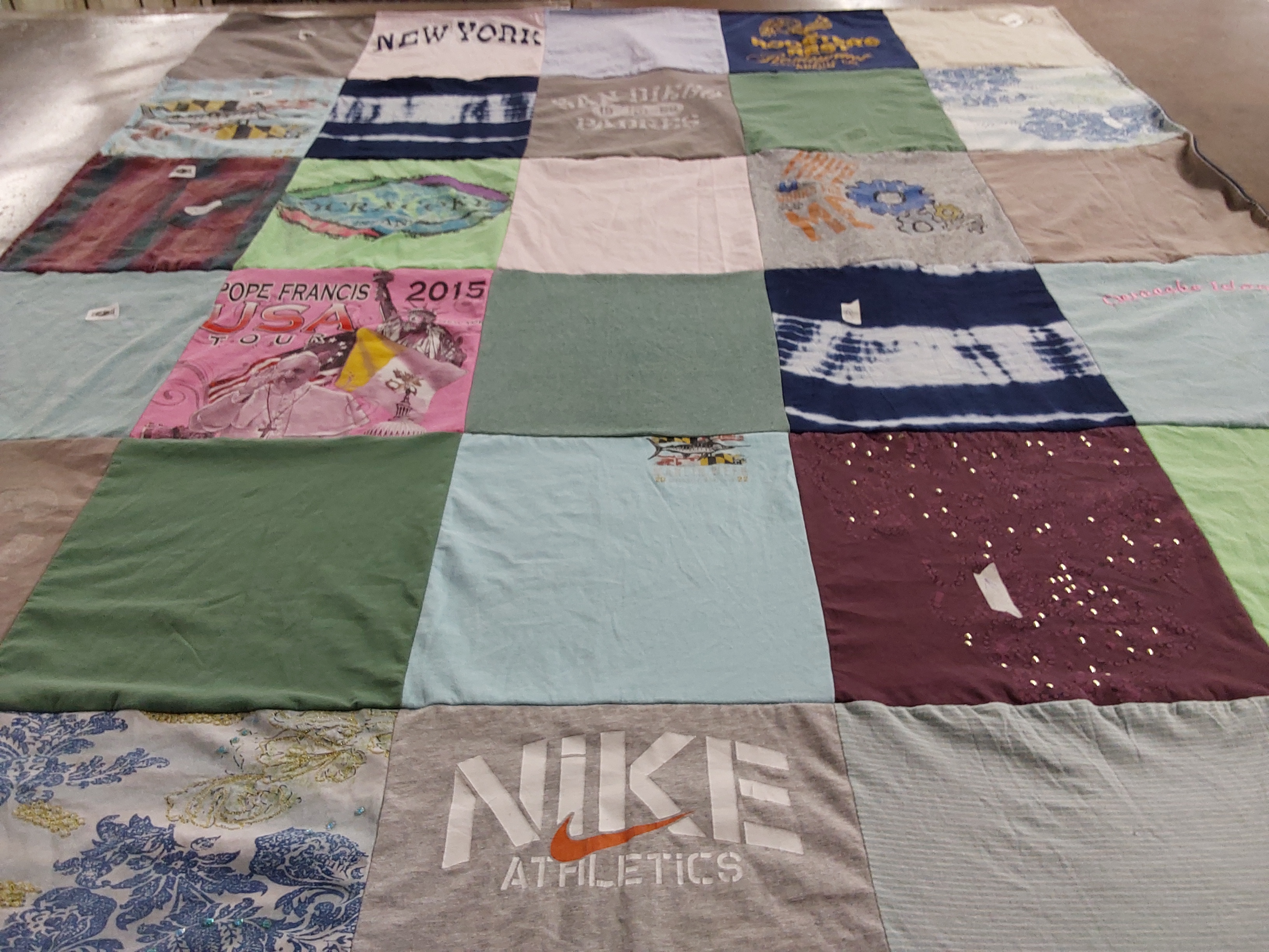 T-shirt quilt with travel, sports themes by Bibiana from PA