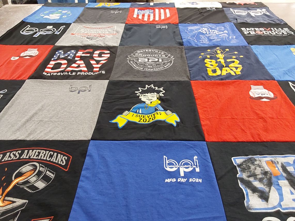T-shirt quilt with manufacturing, community events themes by Karen from OH