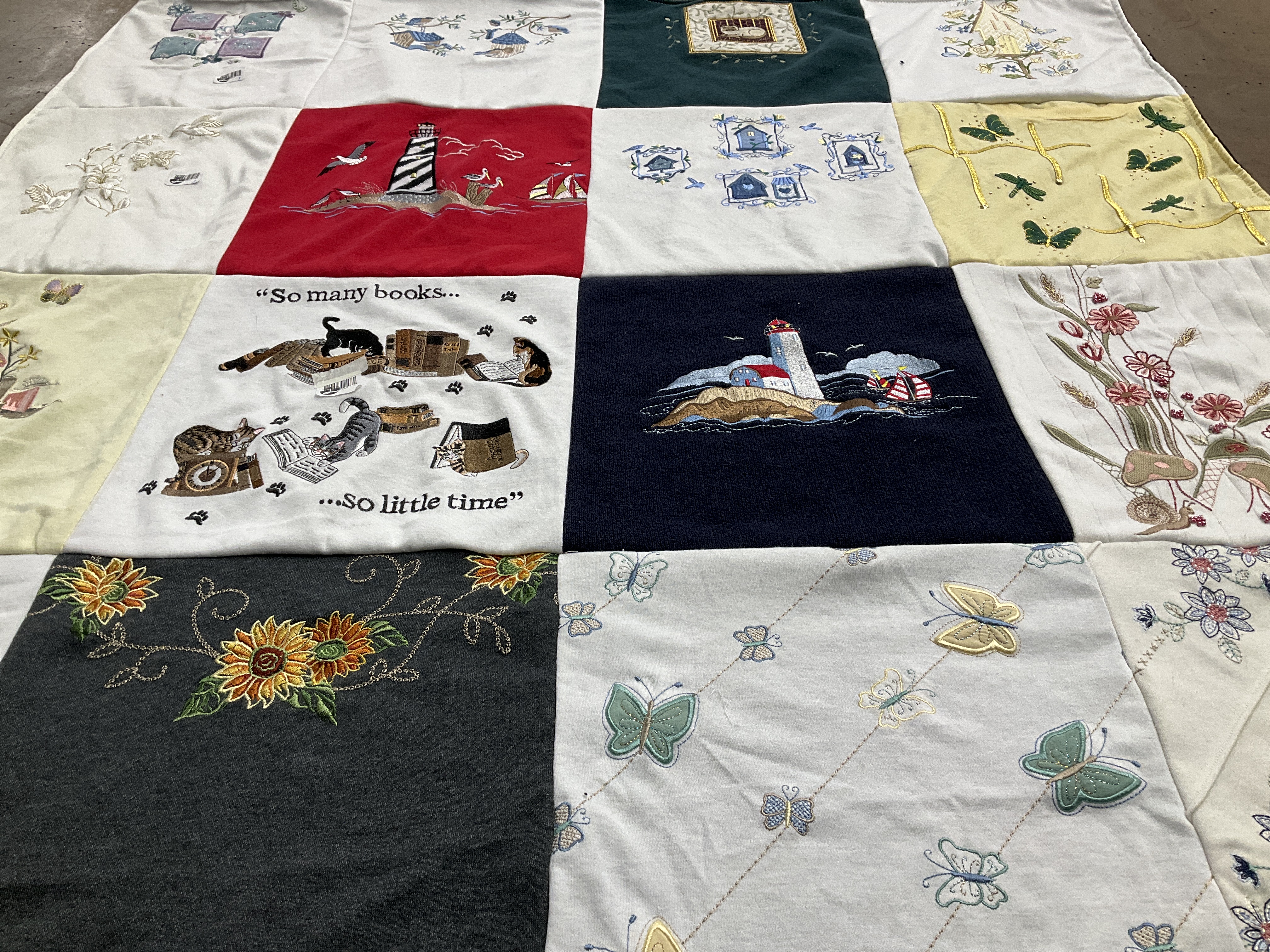 T-shirt quilt with reading, cats themes by Joelle from UT