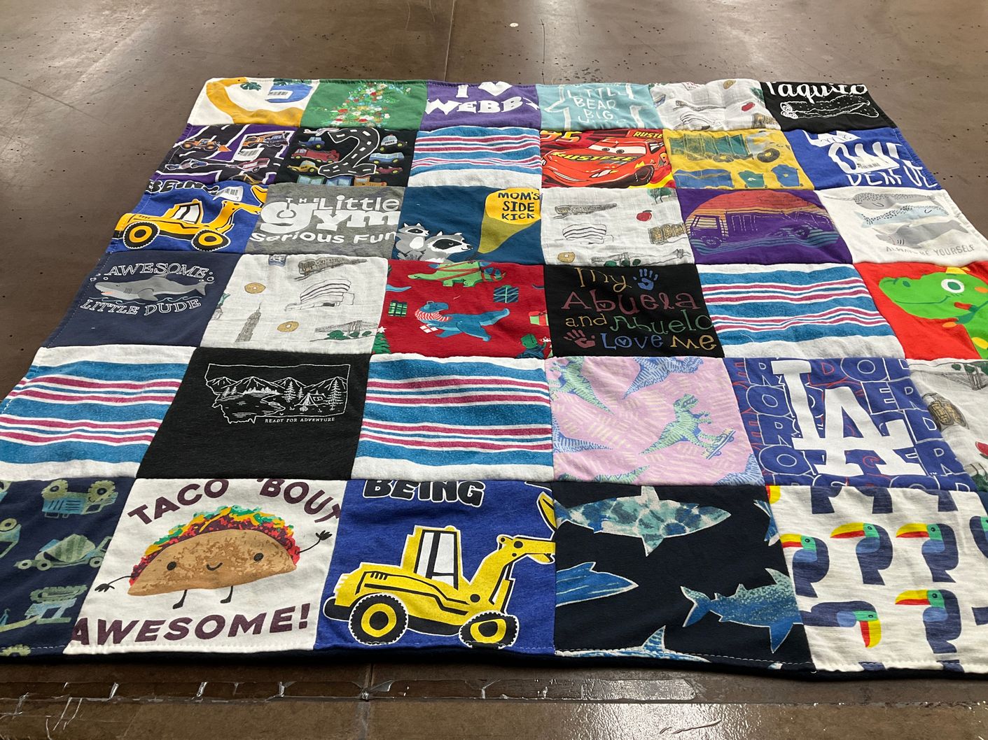 T-shirt quilt with family, fun themes by Victoria from CA