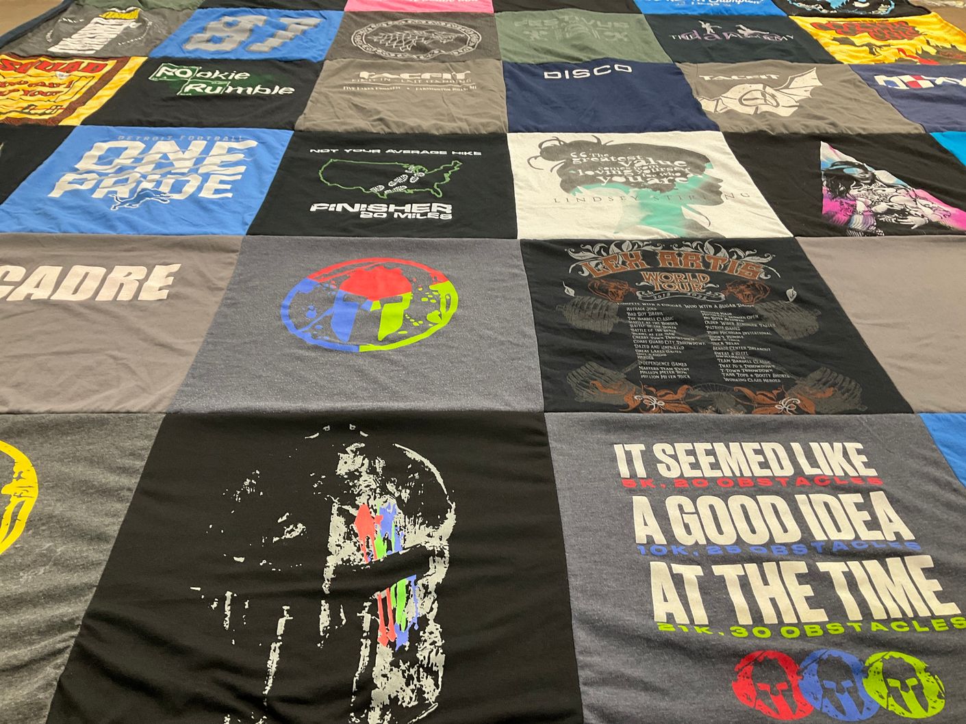 T-shirt quilt with fitness, obstacle racing themes by Beth from MI