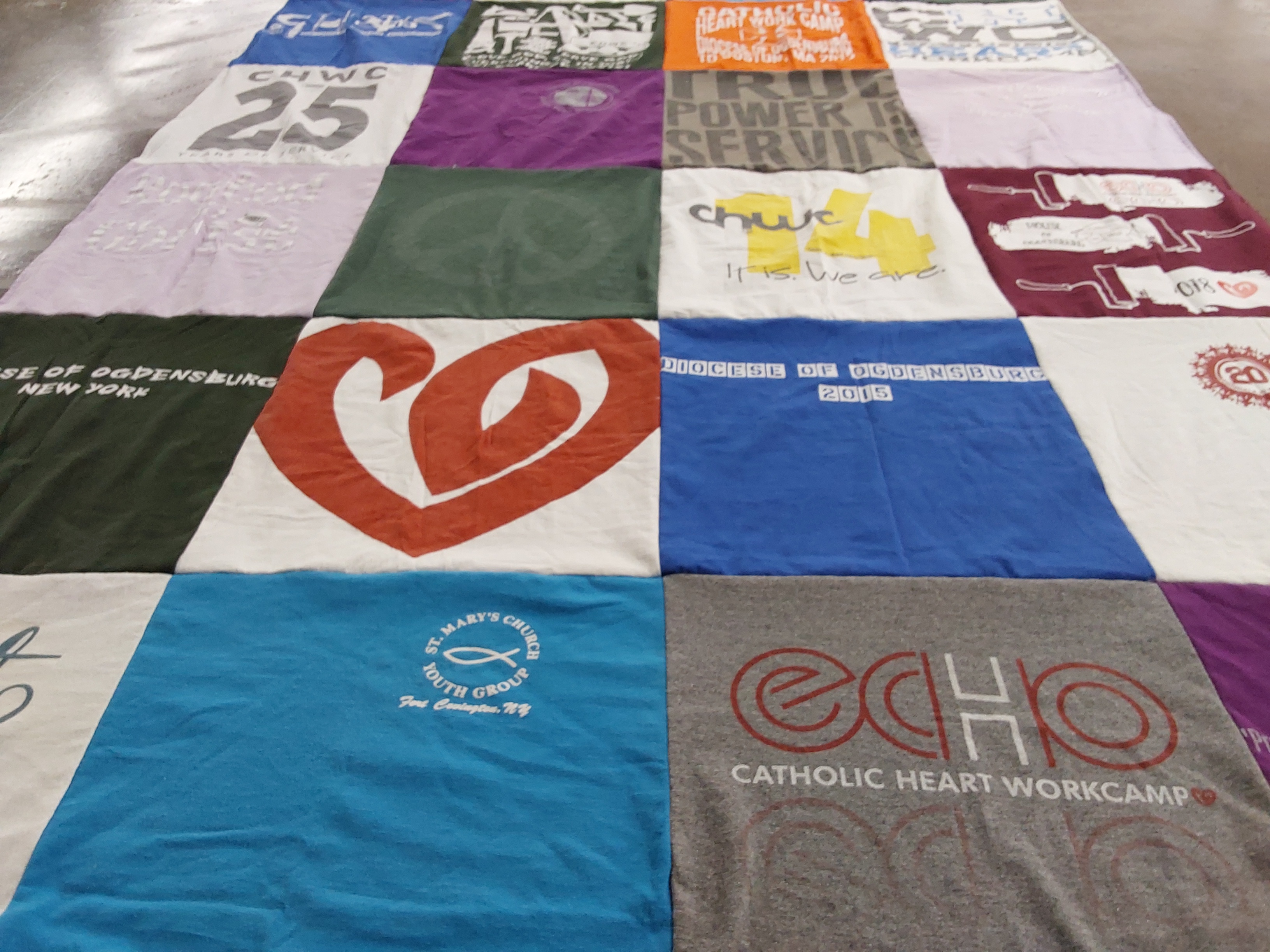 T-shirt quilt with community service, church activities themes by Angela from NY