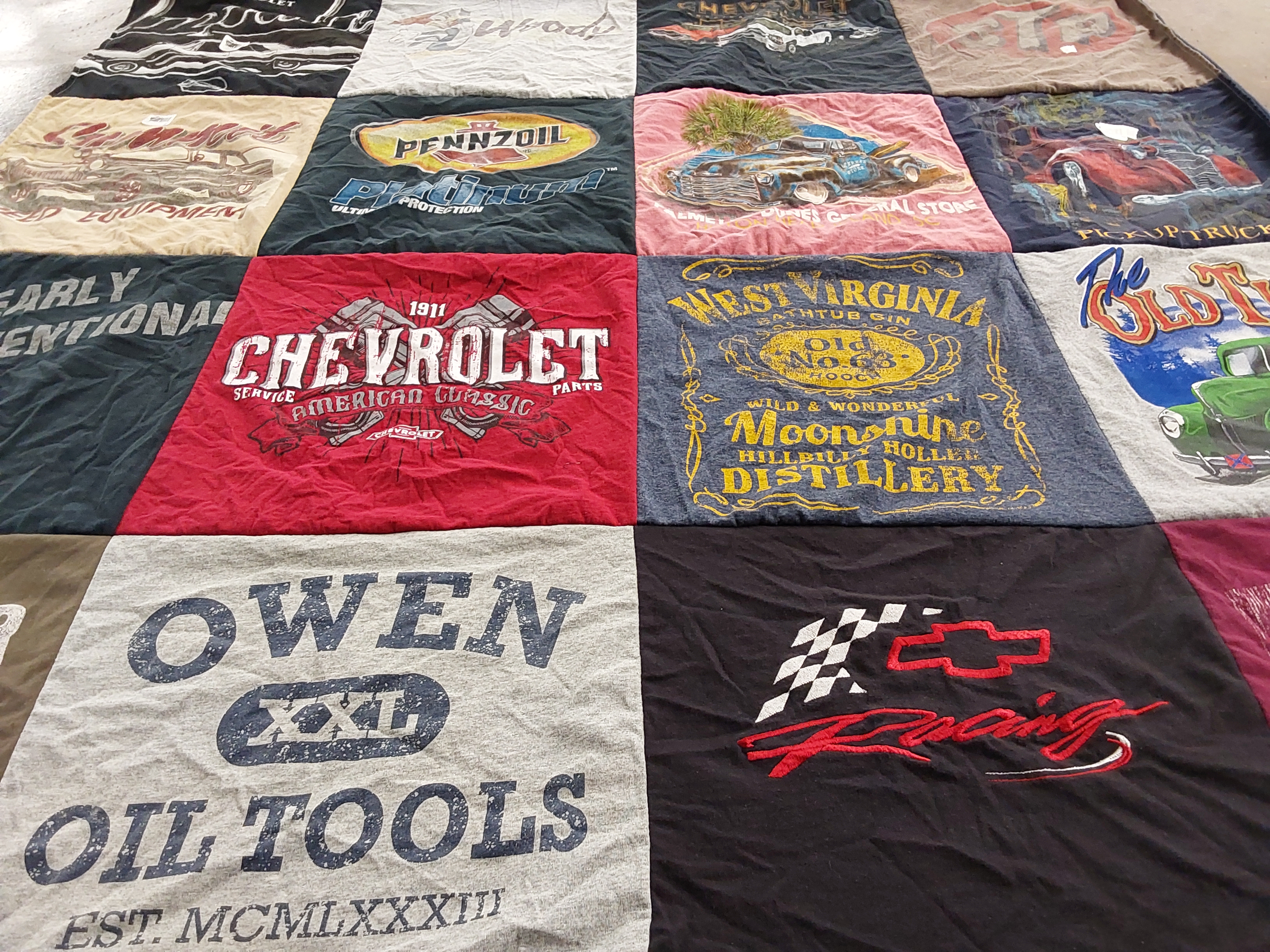 T-shirt quilt with automotive, distilling themes by Kasi from WV