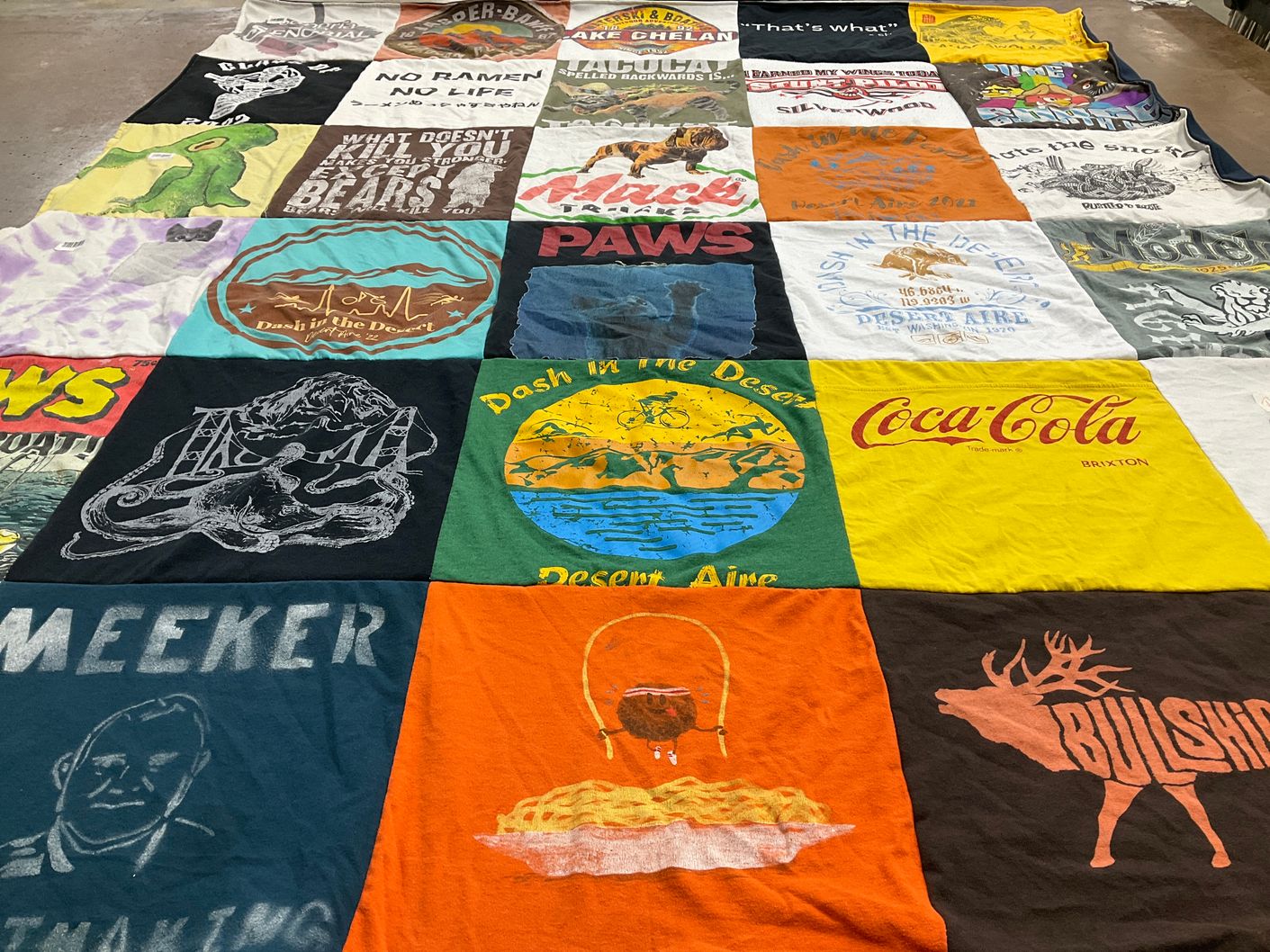 T-shirt quilt with cooking, outdoors themes by Laurie from WA