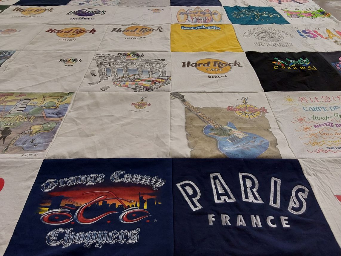 T-shirt quilt with travel, music themes by Dawn from CO