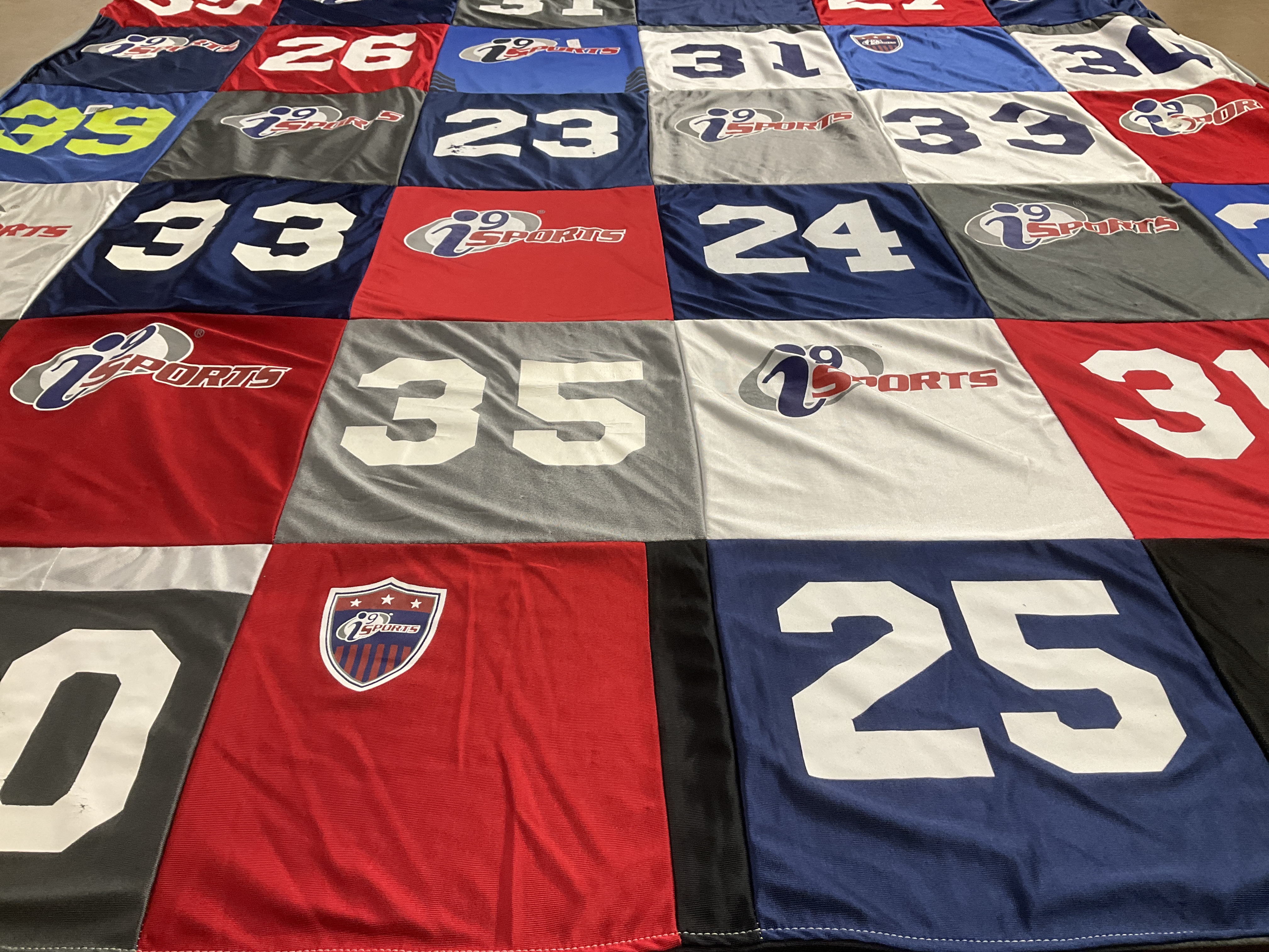 T-shirt quilt with sports themes by Lora from FL