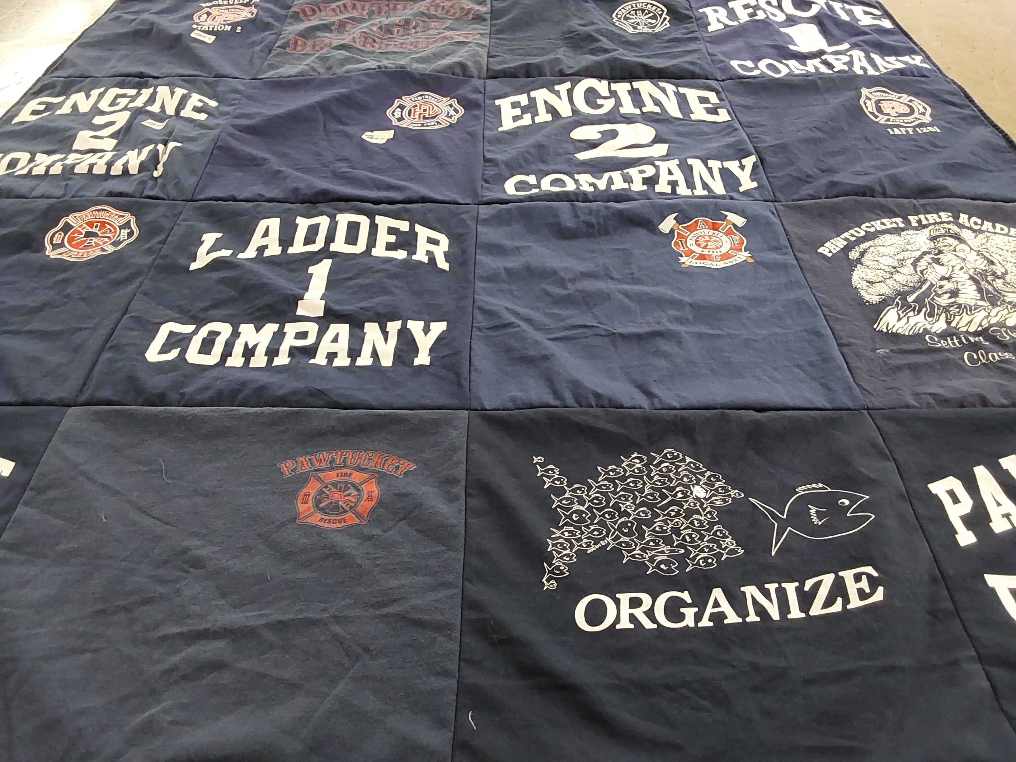 T-shirt quilt with firefighting, community service themes by Nichole from RI