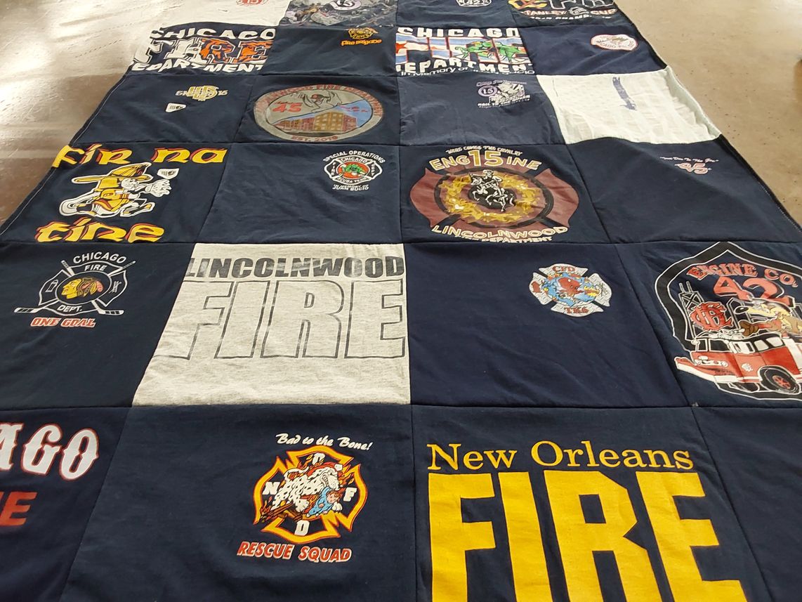T-shirt quilt with firefighting, emergency services themes by Anna from IL