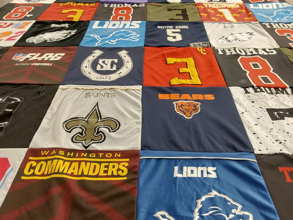 T-shirt quilt featuring new orleans saints, detroit lions by Yan from CA