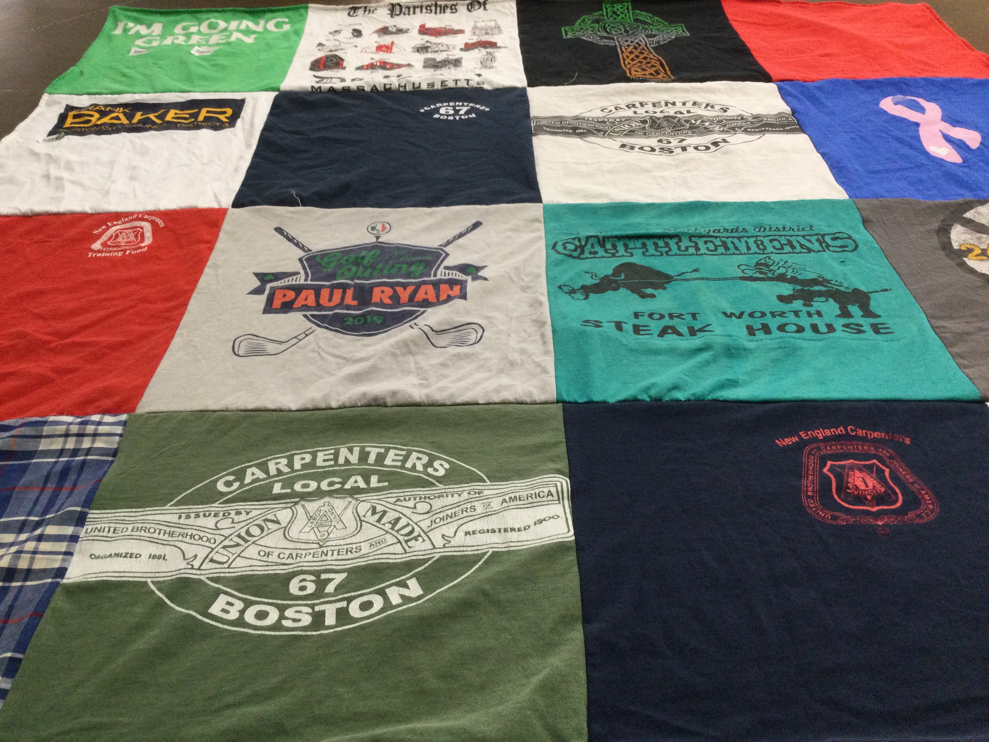 T-shirt quilt with carpentry, golfing themes by Julie from MA